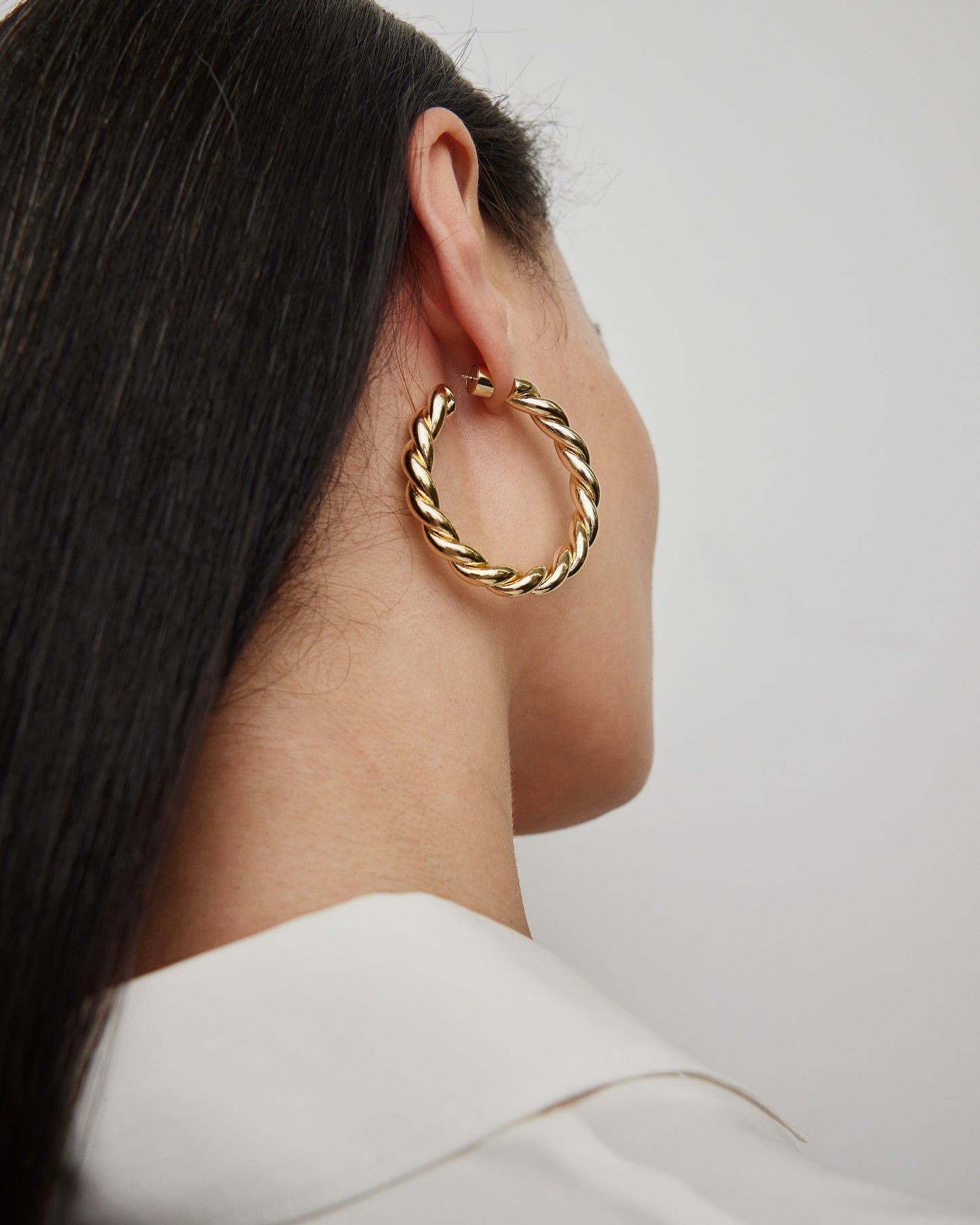 Jennifer Fisher - 1.5' Twisted Lilly Baby Hoops on model - Yellow Gold