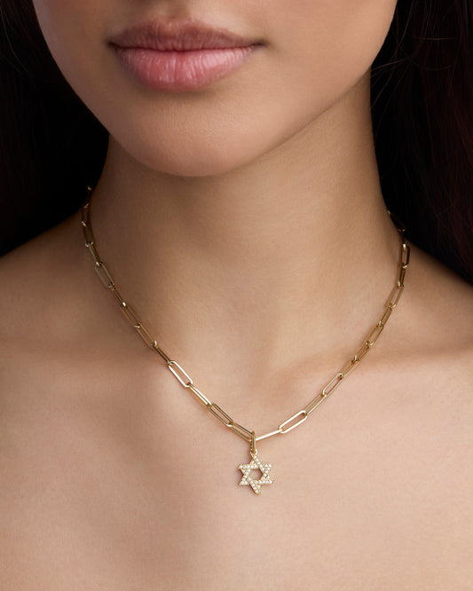 Star of David charm on chain on models neck