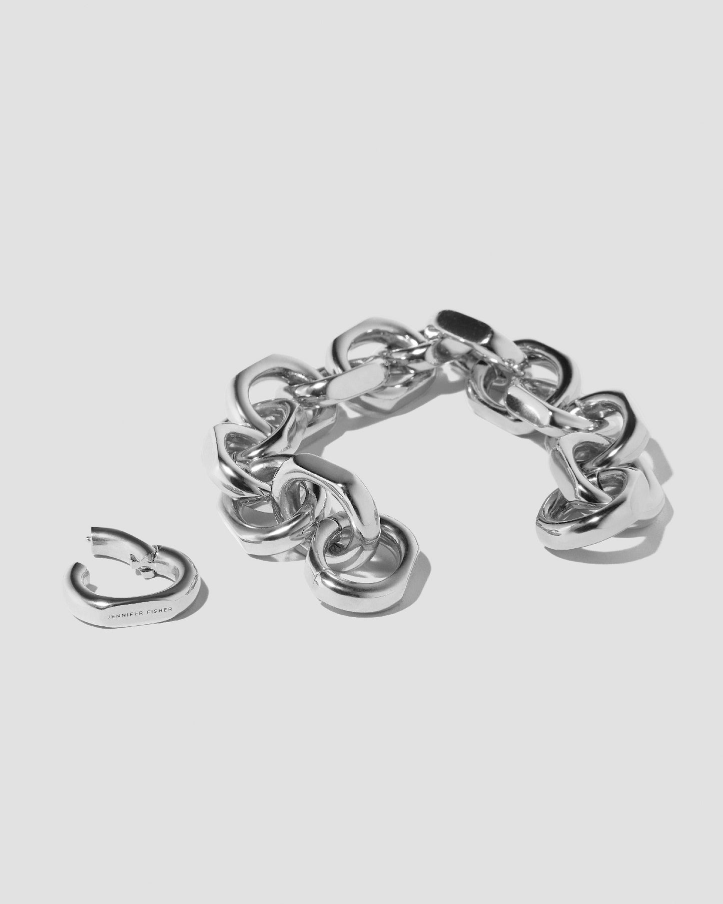 Bracelet on grey background with link off.