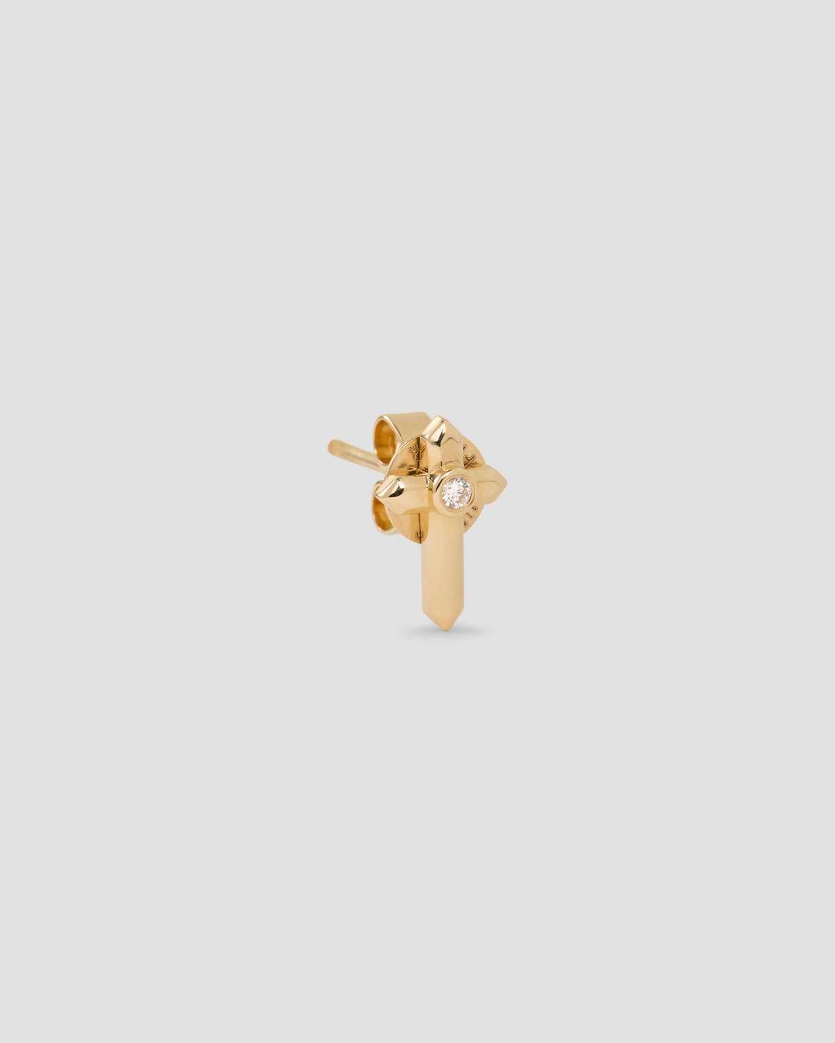 Cross Stud gold earring - close-up detail | diamond stud earrings