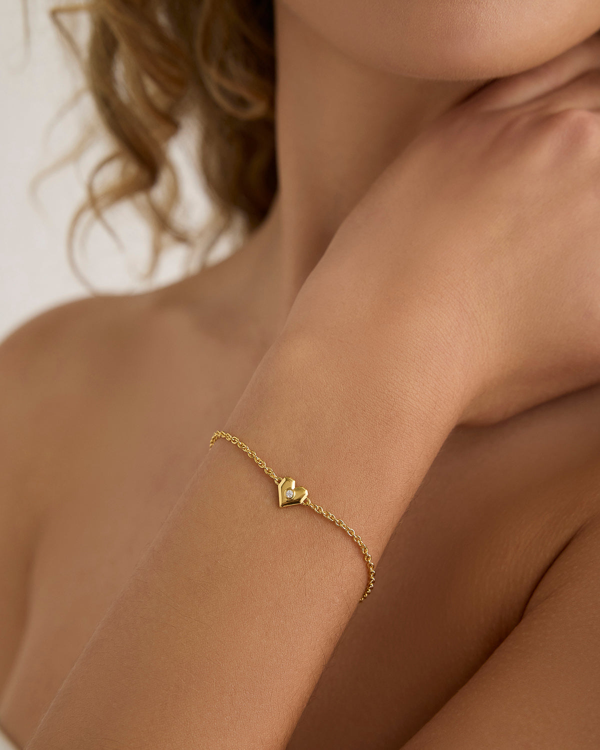 Heart bracelet - styled on model | female gold bracelet