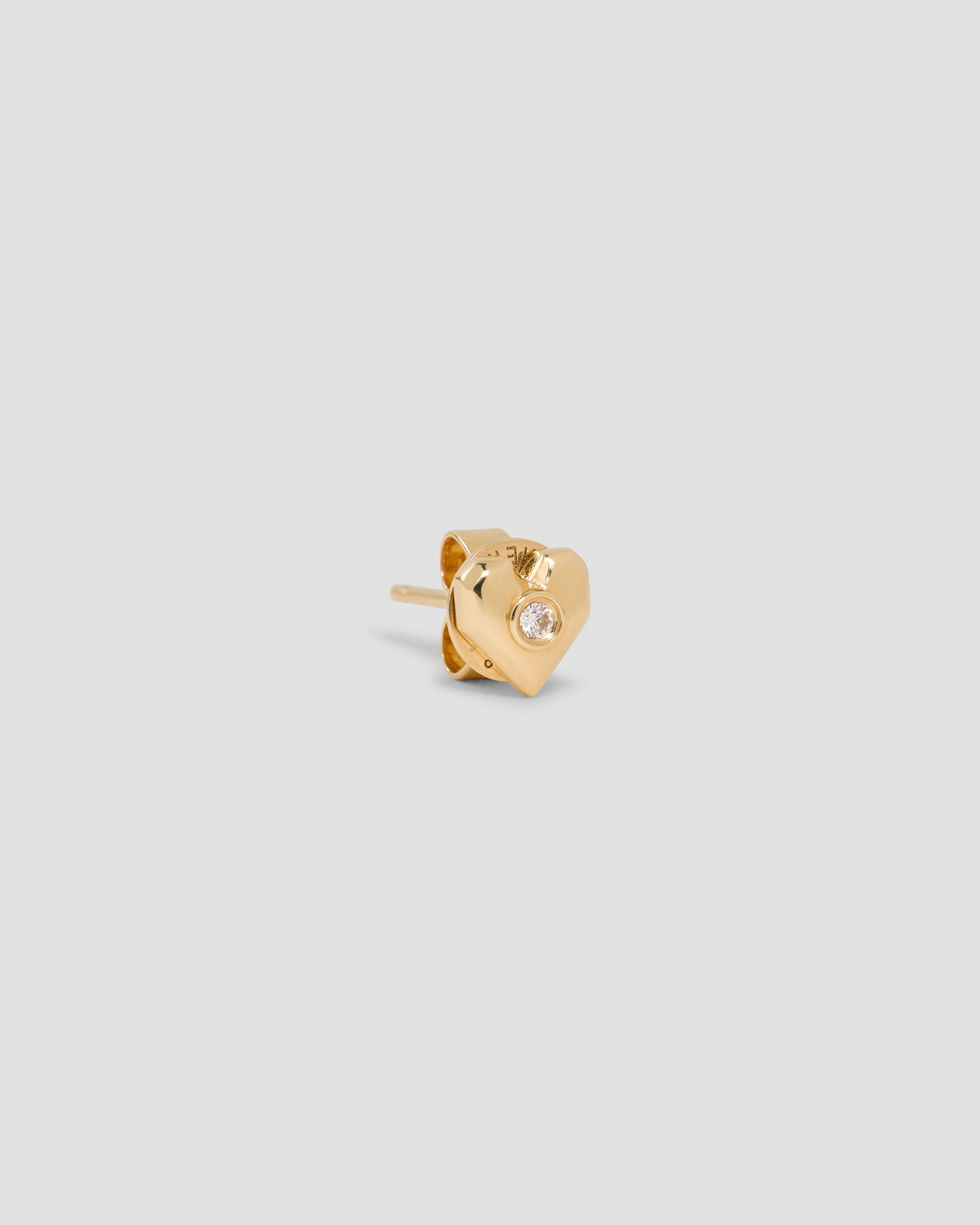 Heart Stud gold earring - styled on model | diamond stud earrings