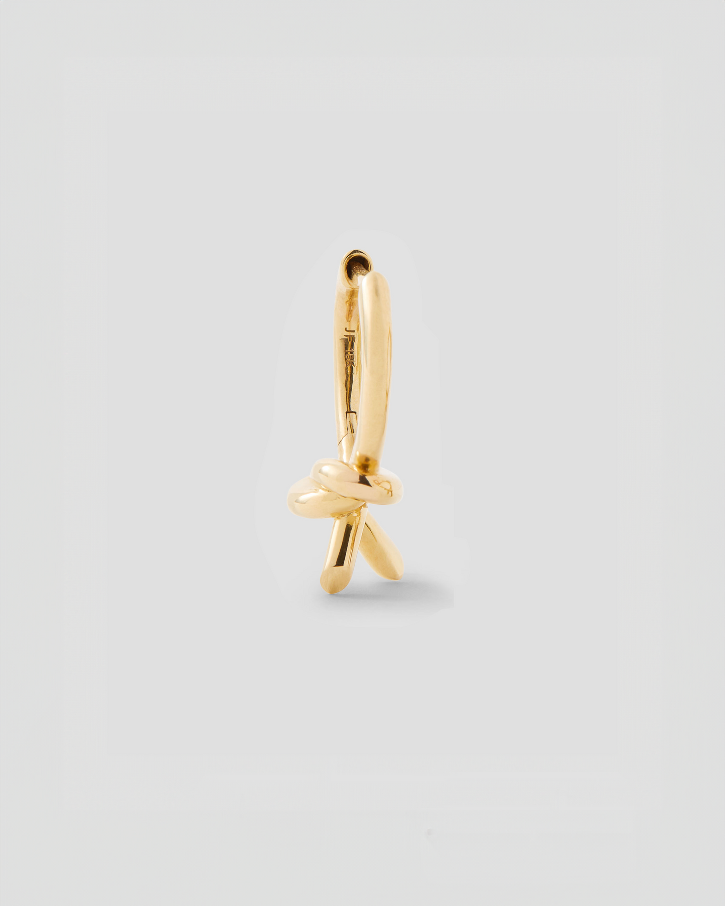Knot Huggie in 18K Yellow Gold