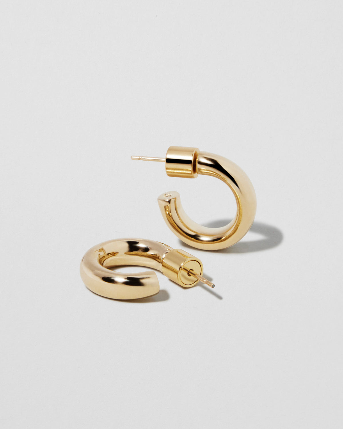 Lilly Micro Huggies earring - alternate angle | gold hoop earrings for women