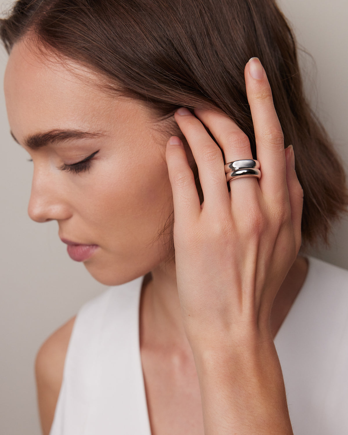 Model wearing ring and posing
