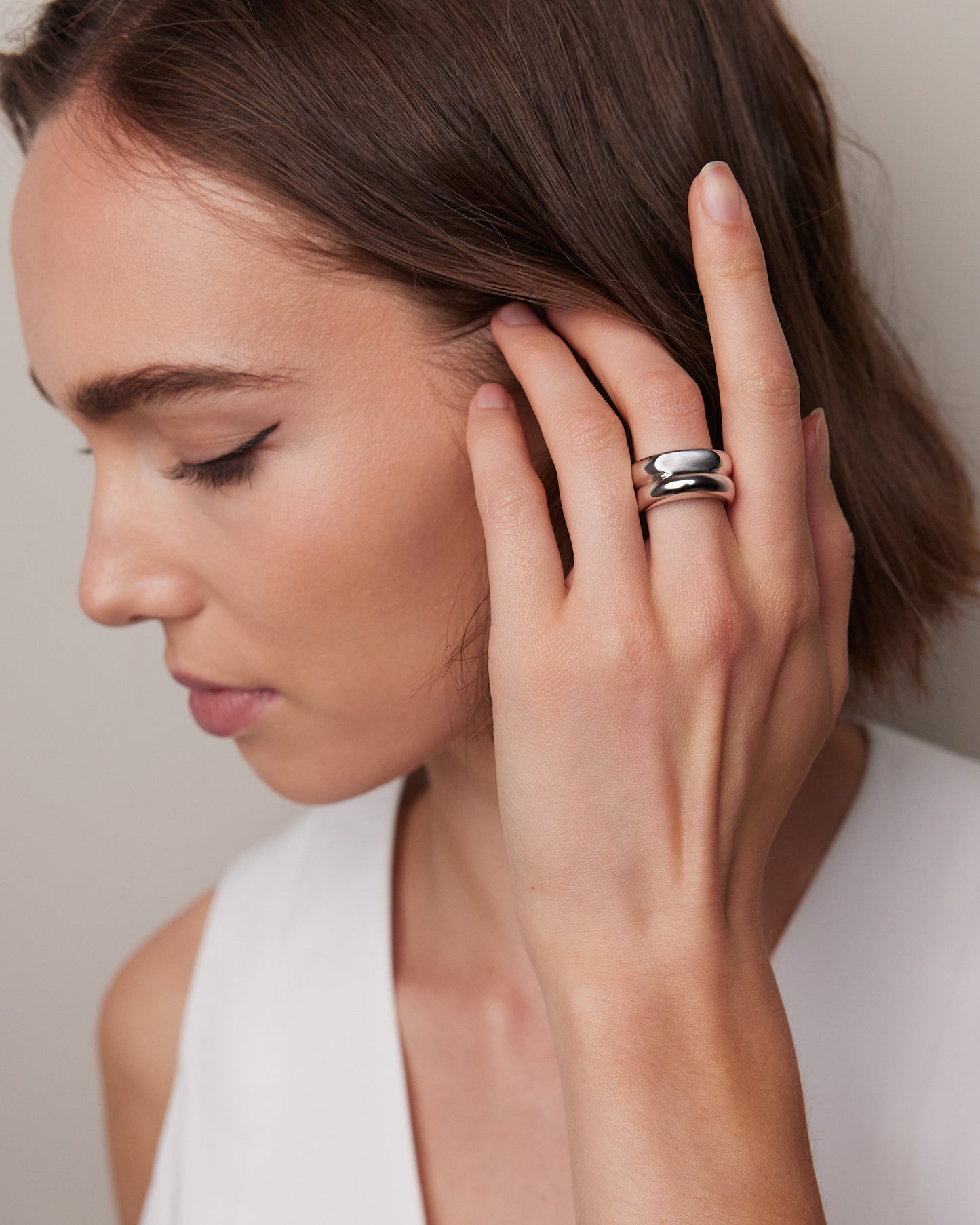 Model wearing ring and posing
