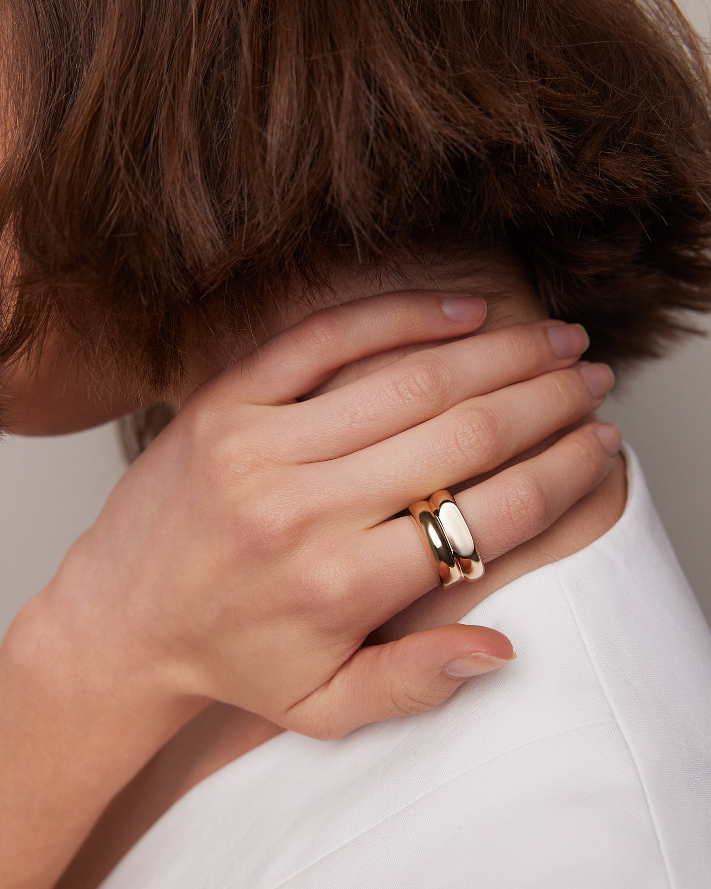 Model wearing ring and posing