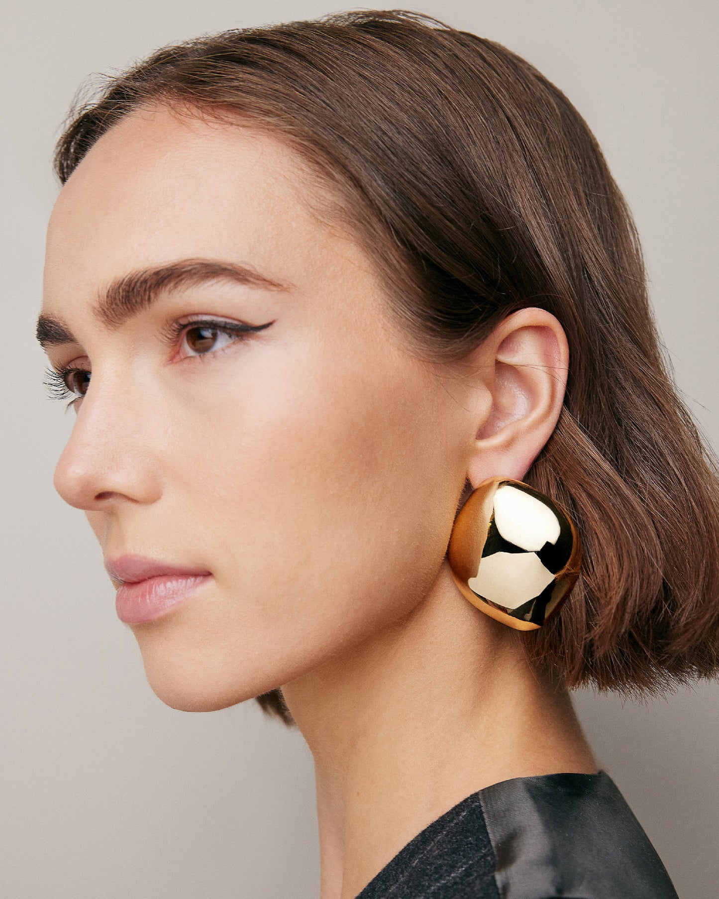 Model wearing Puffy Cushion Earrings.