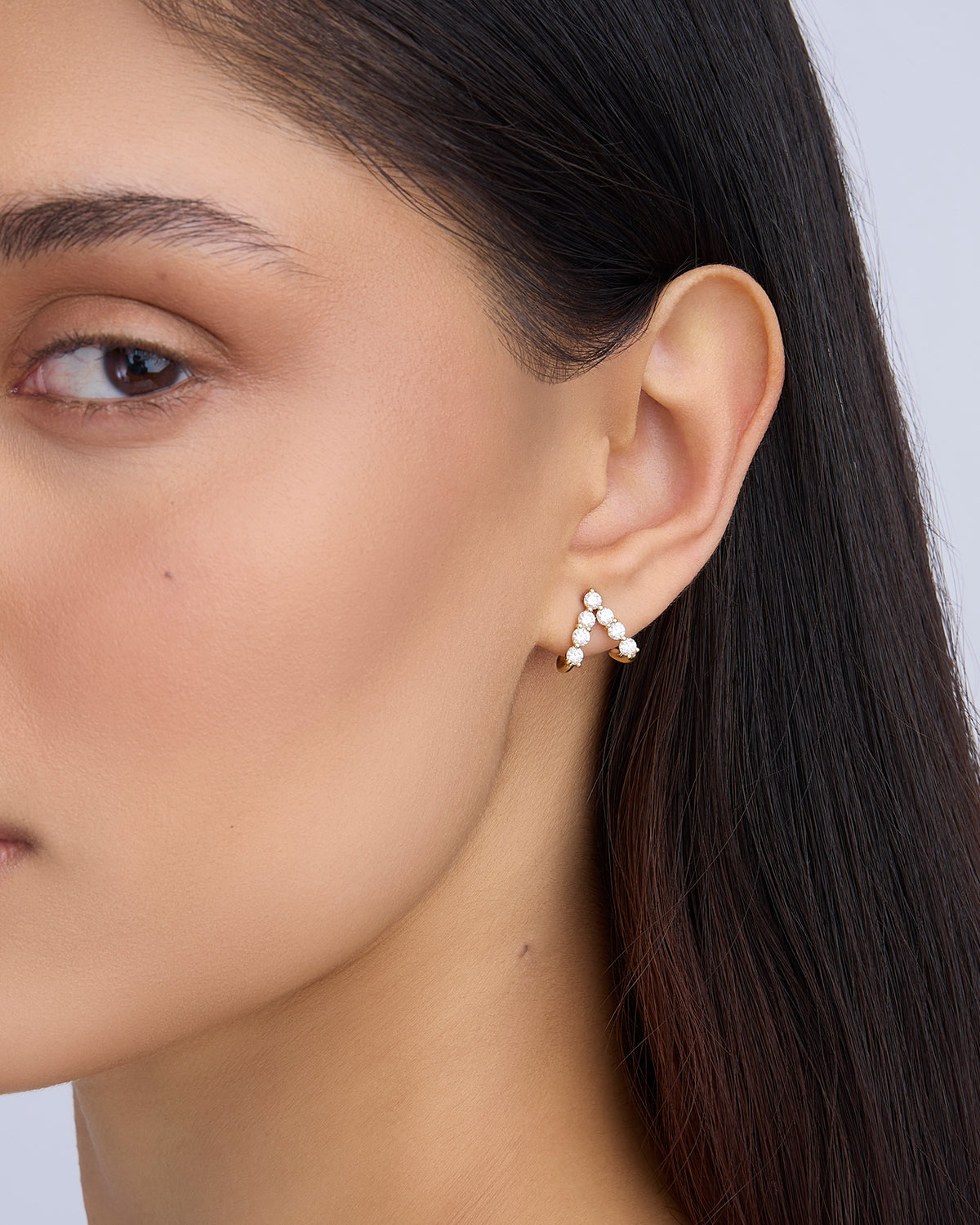 Floating Seven Diamond Double Huggies 18K gold earring - close-up detail | diamond huggie earrings