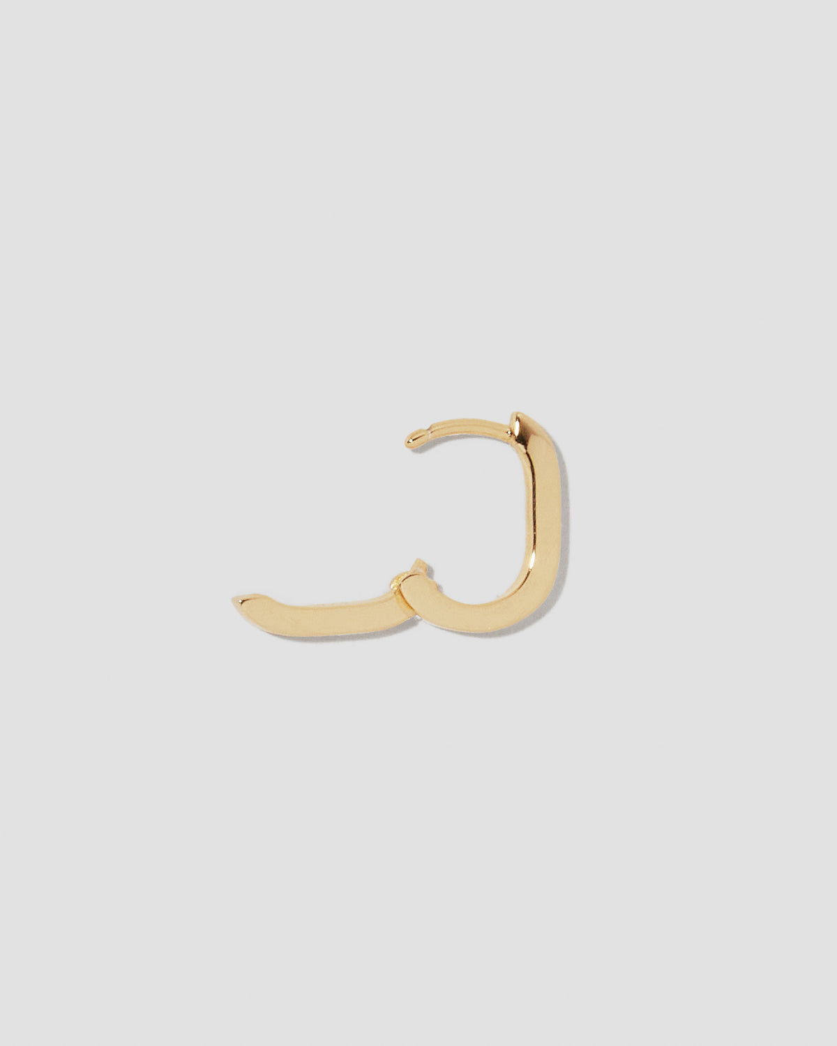 18k Link Huggie earring - styled on model | gold huggie earrings