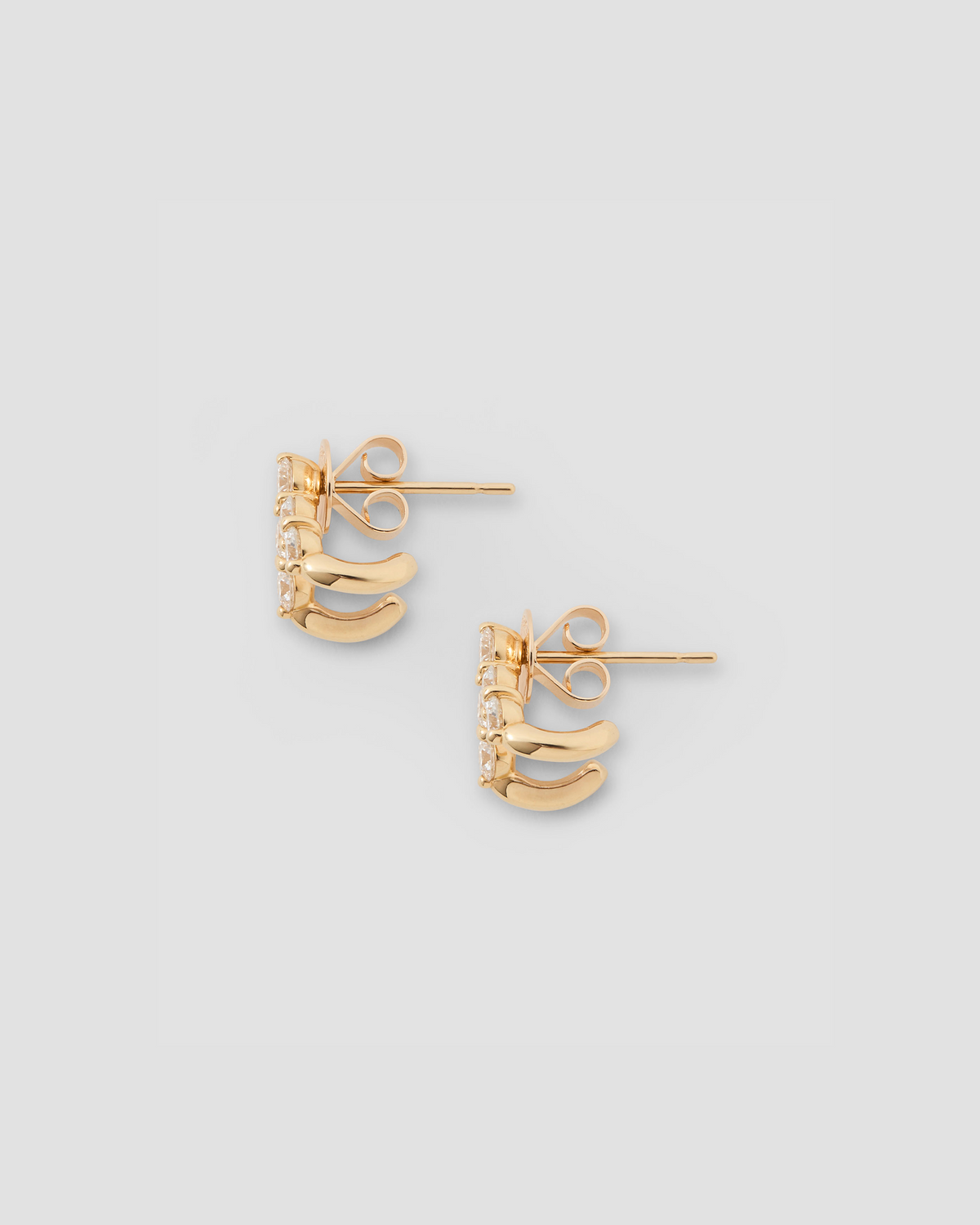 Floating Five Diamond Double Huggies 18K gold earring - product detail shot | diamond huggie earrings
