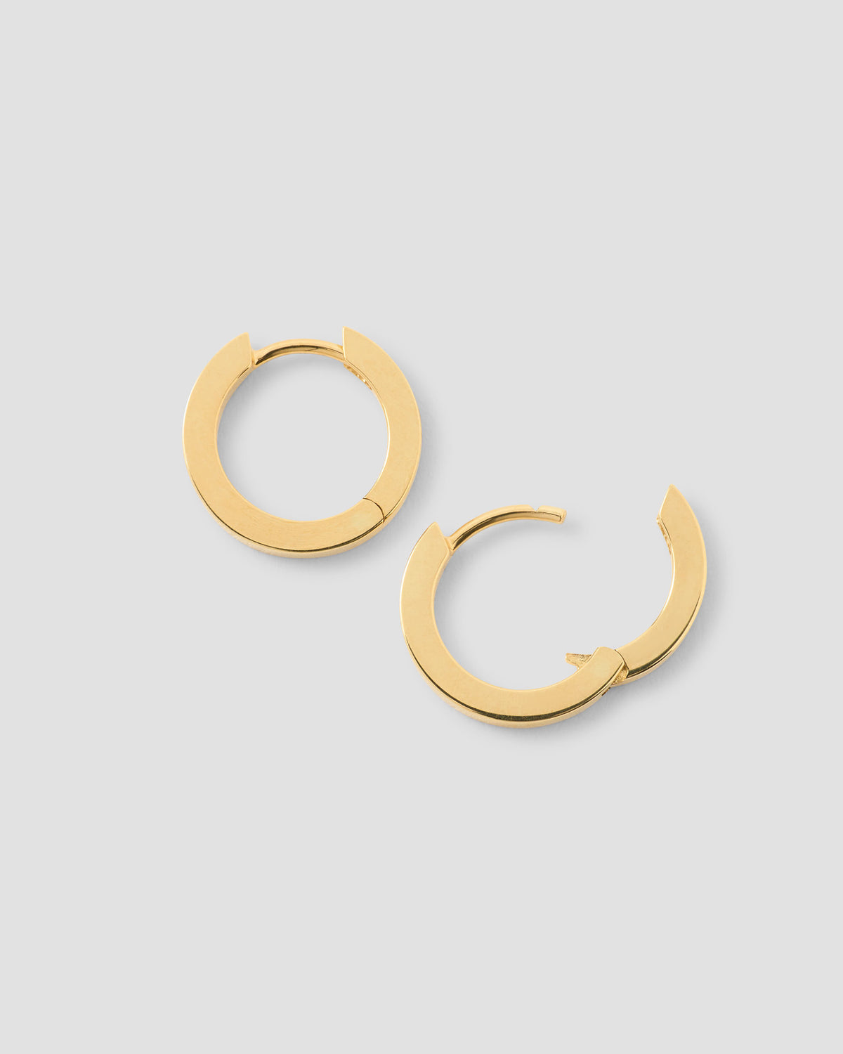 18k Small Huggie earring - styled on model | gold huggie earrings