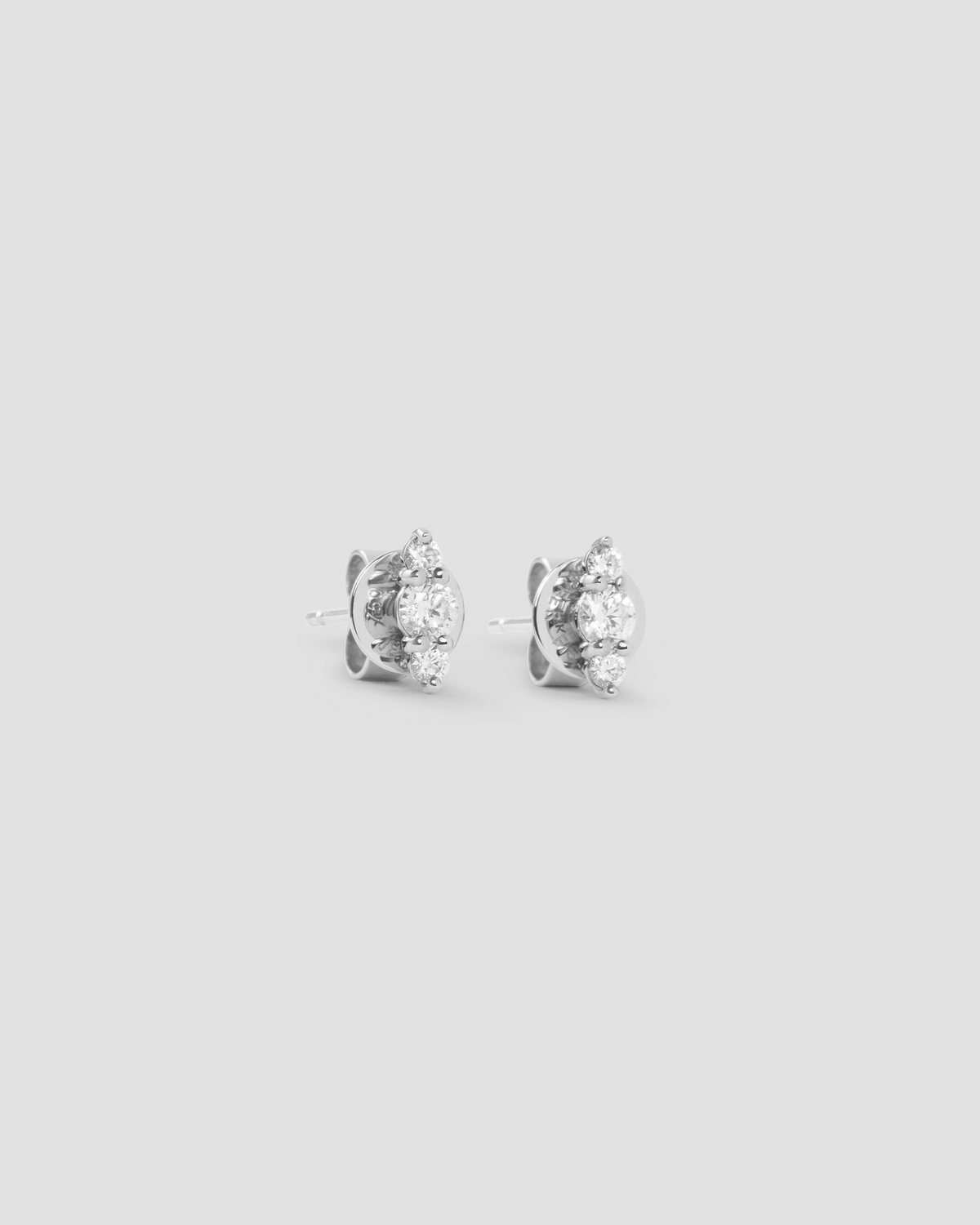Floating Three Diamond Stud Earring gold earring - alternate angle | diamond stud earrings