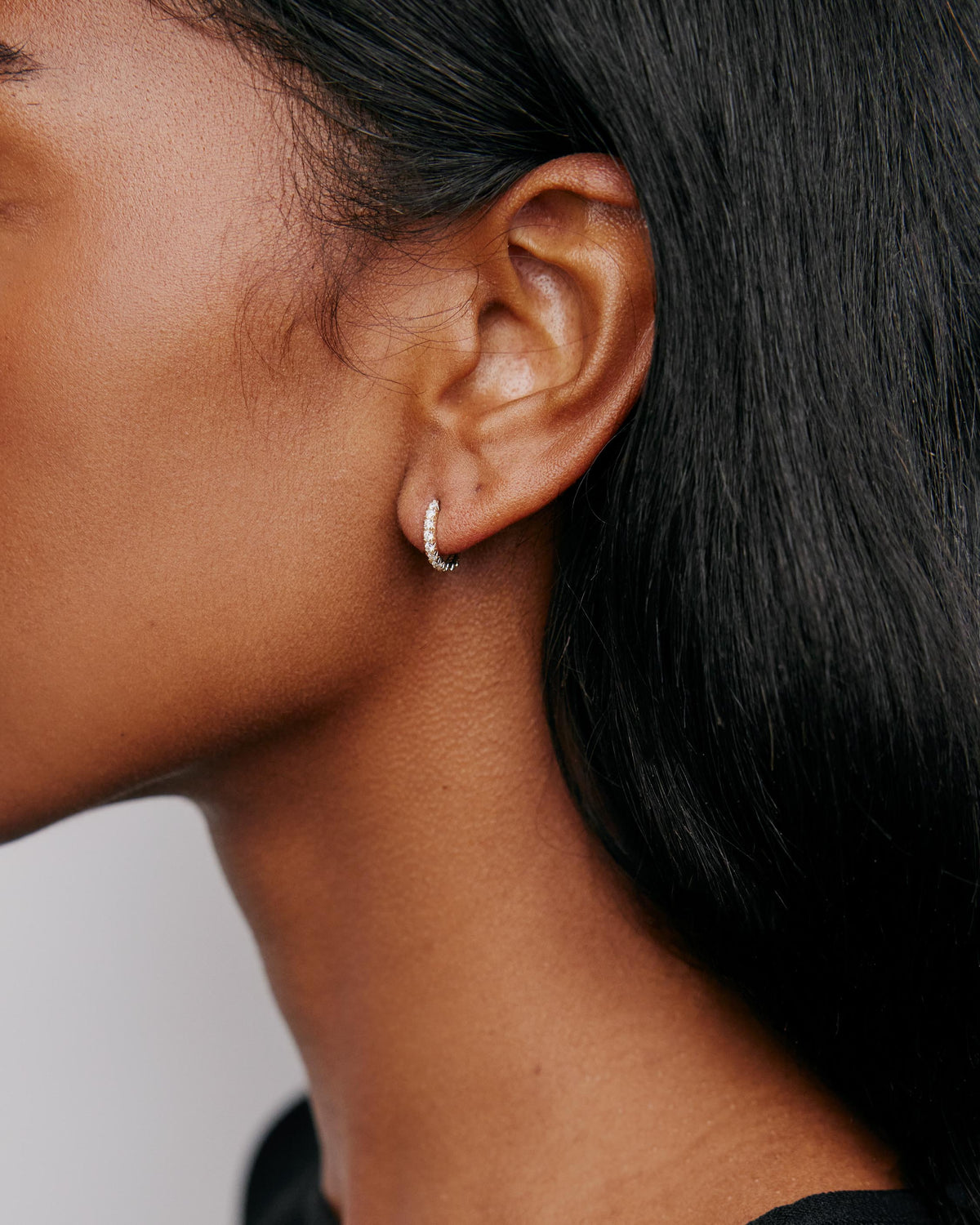 Pavé Diamond Pin Huggie in 18K Yellow Gold earring - close-up detail | diamond huggie earrings
