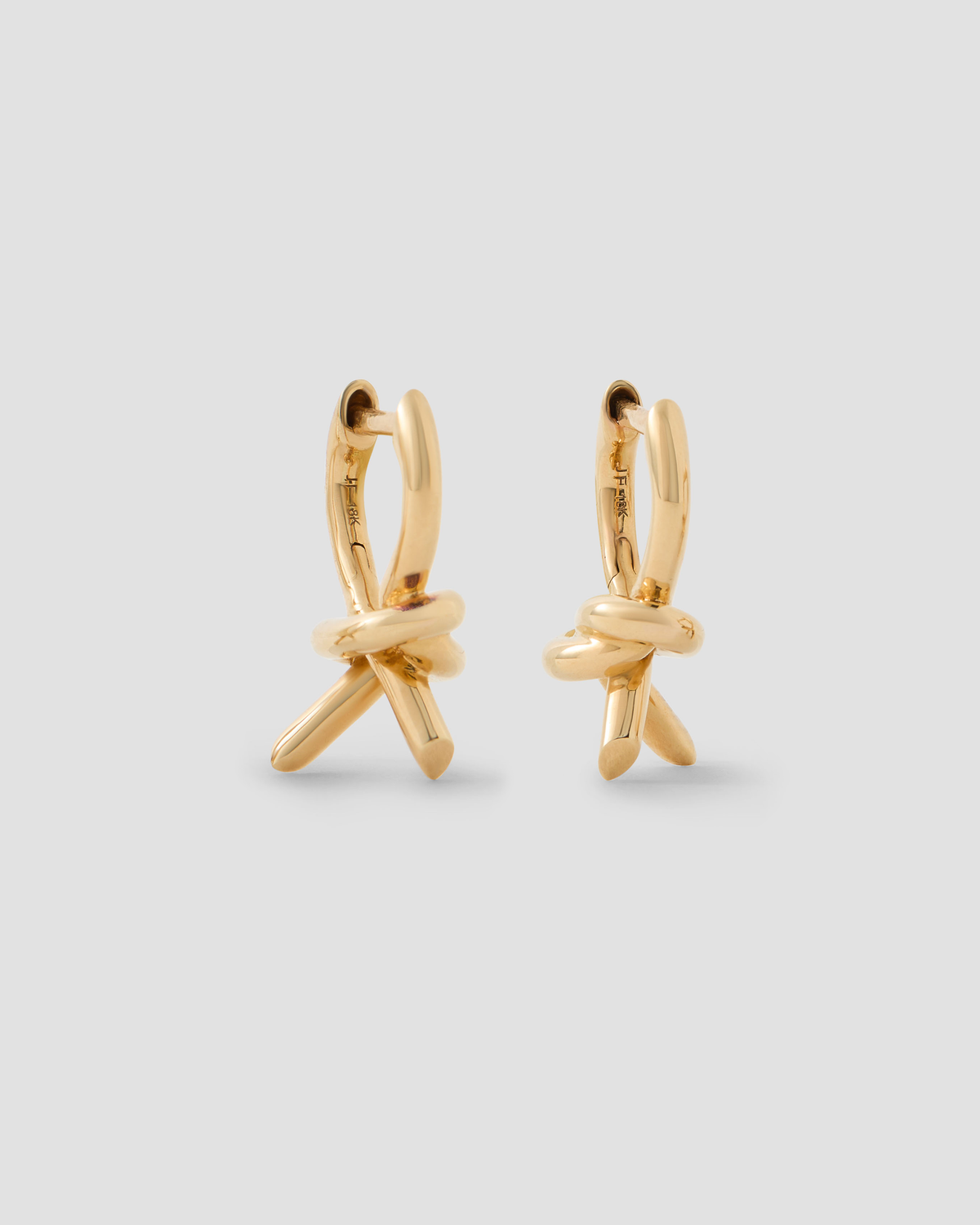 Knot Micro Huggie earring - front view | gold huggie earrings