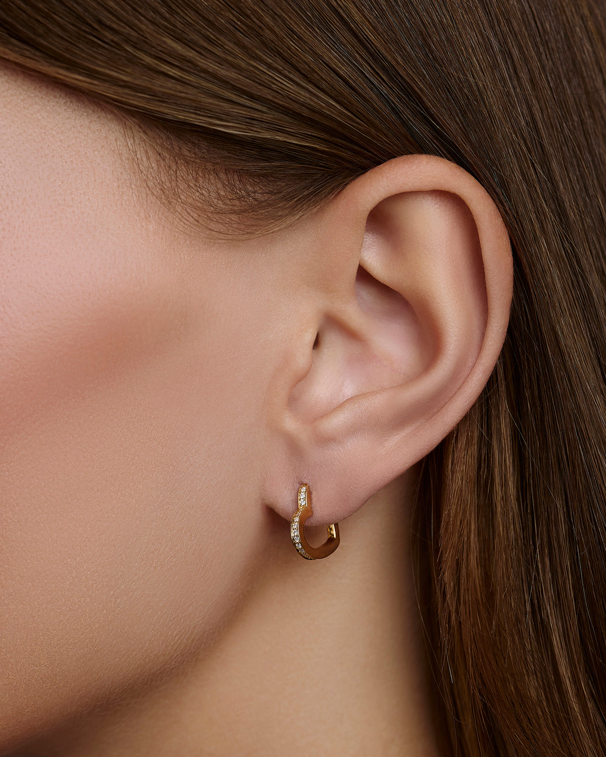18k Small Heart Huggie With Pavé White Diamonds gold earring - close-up detail | diamond huggie earrings