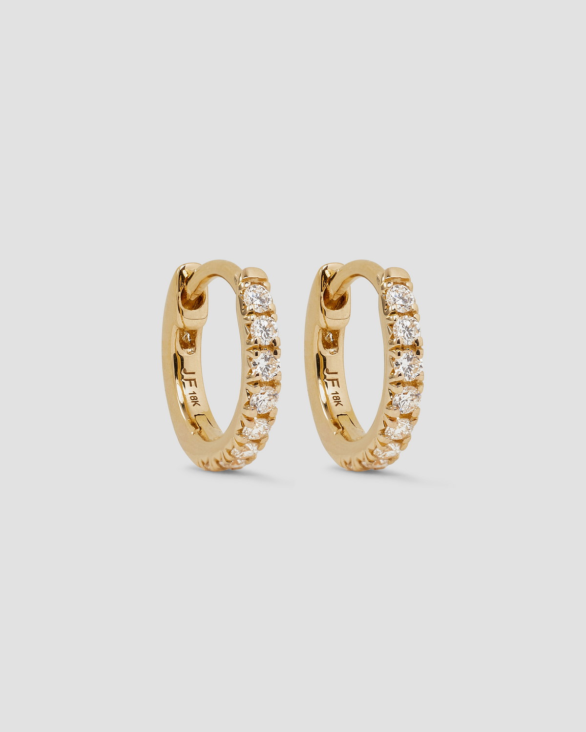 18K Essential Pavé Tiny Huggie gold earring - product detail shot | diamond huggie earrings