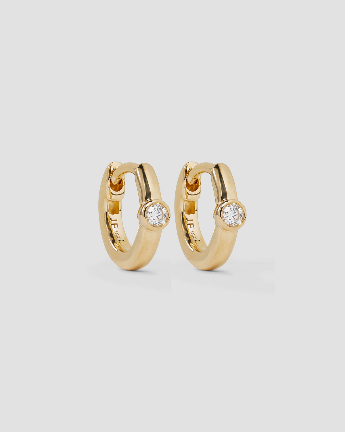 18K Essential Single Stone Tiny Huggie gold earring - front view | diamond huggie earrings