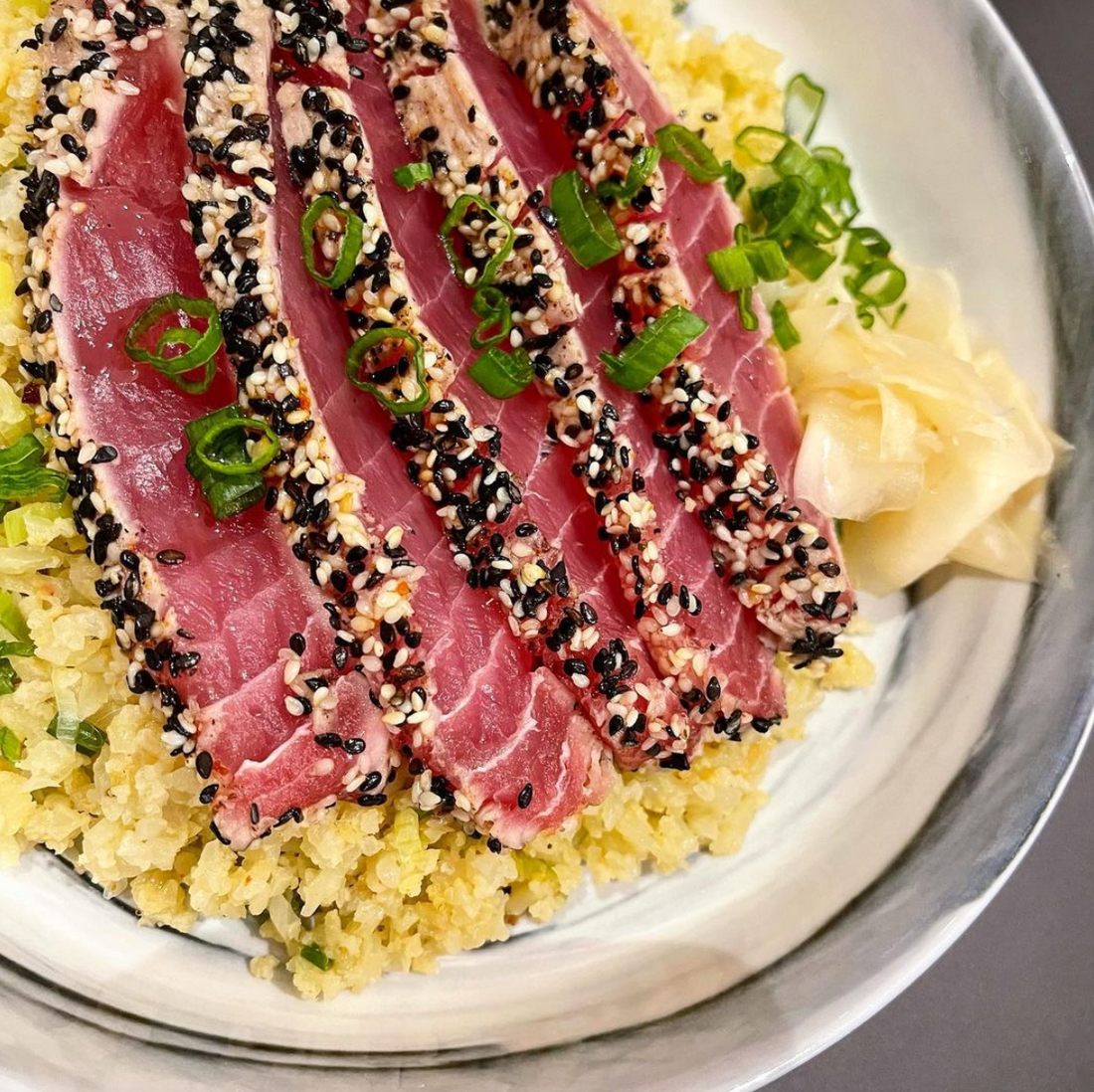 SOY FREE SESAME CRUSTED SEARED AHI TUNA OVER GREEN ONION AND GINGER FRIED CAULIFLOWER RICE