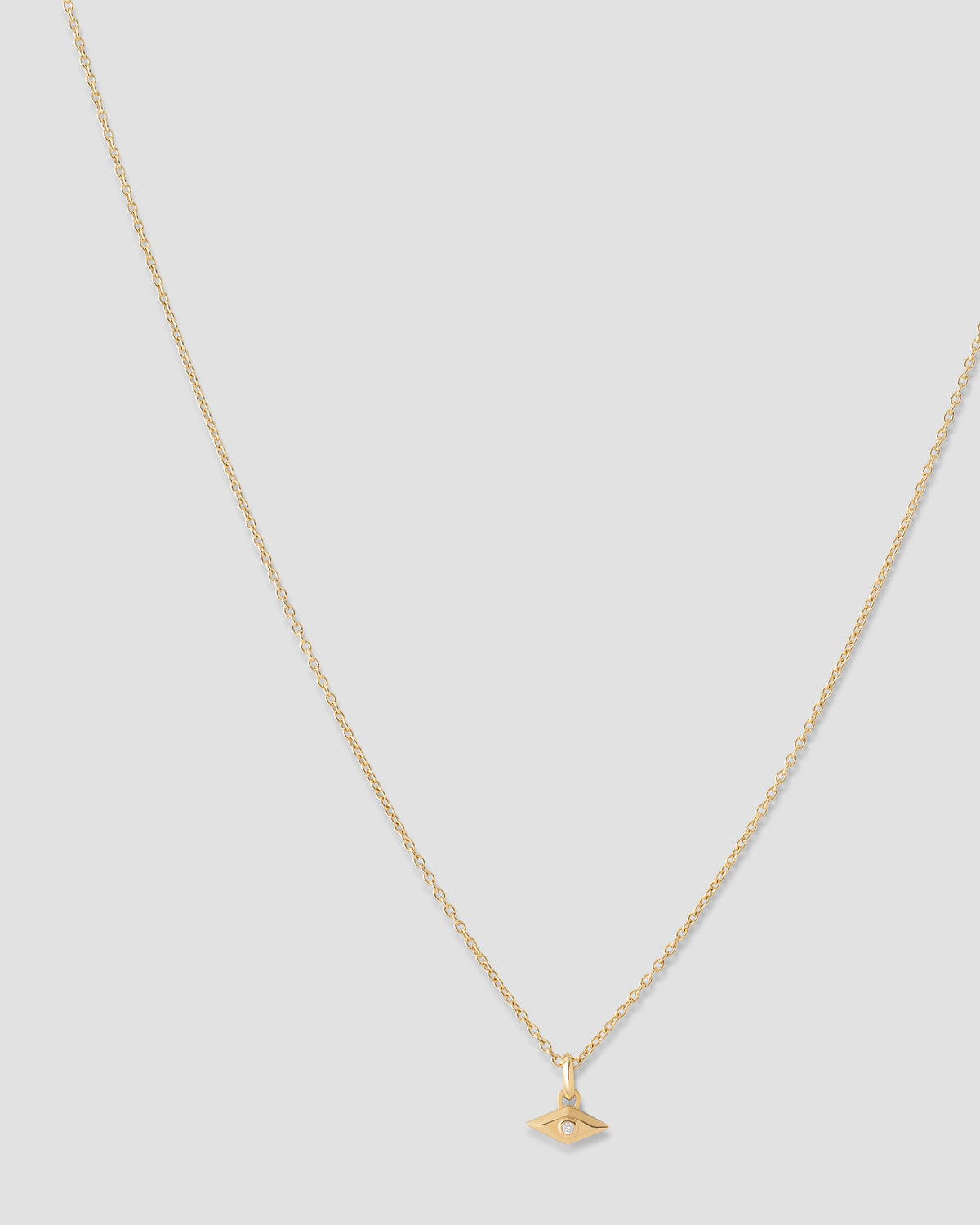 Evil Eye Necklace gold charm - styled on model | necklace with charms