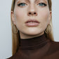 1.5" diamond hoops on model wearing brown top