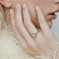 Model wearing Marquise shaped diamond on a gold band