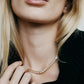 Close up of model wearing a diamond necklace