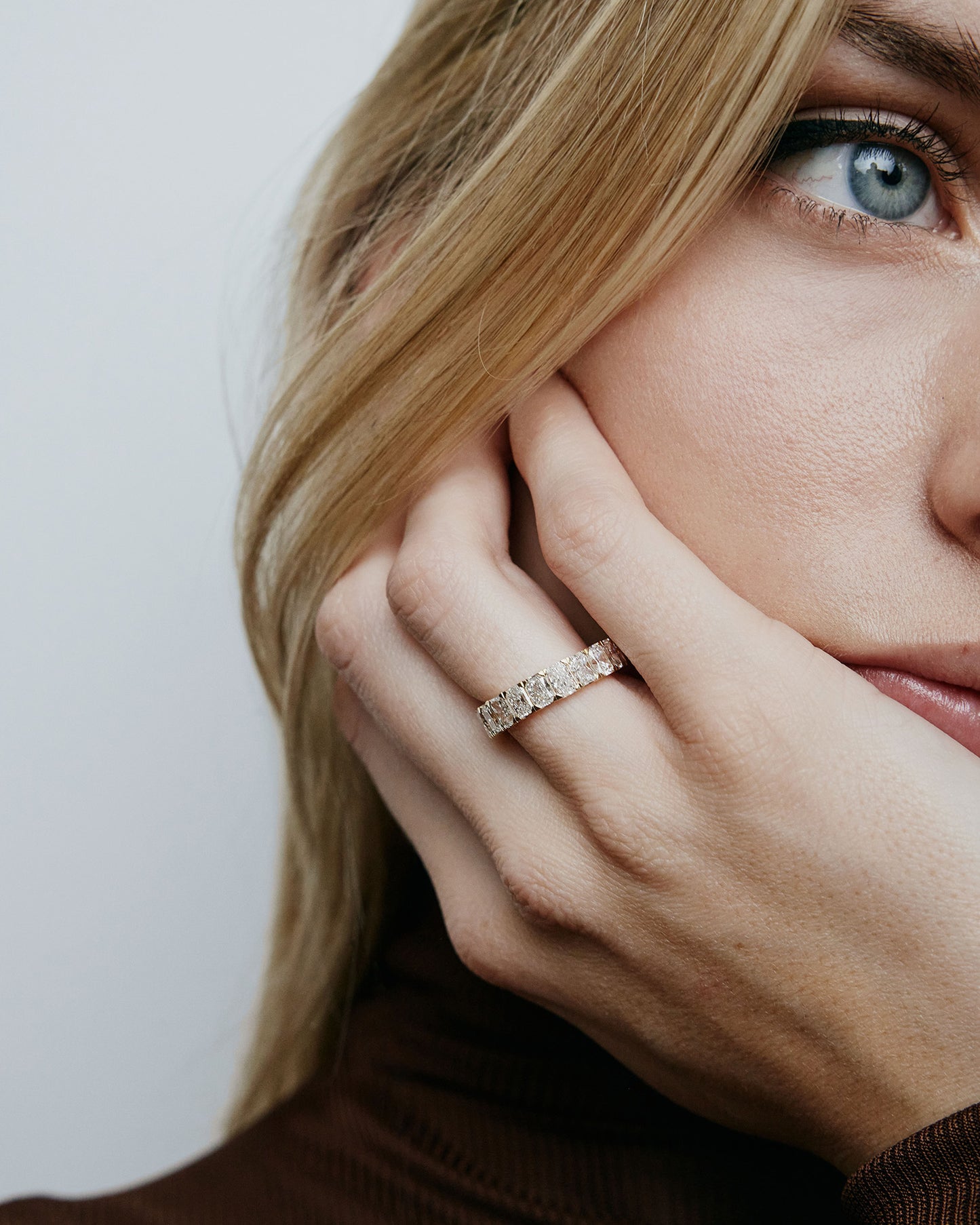 Model wearing rectangle shaped diamond band ring