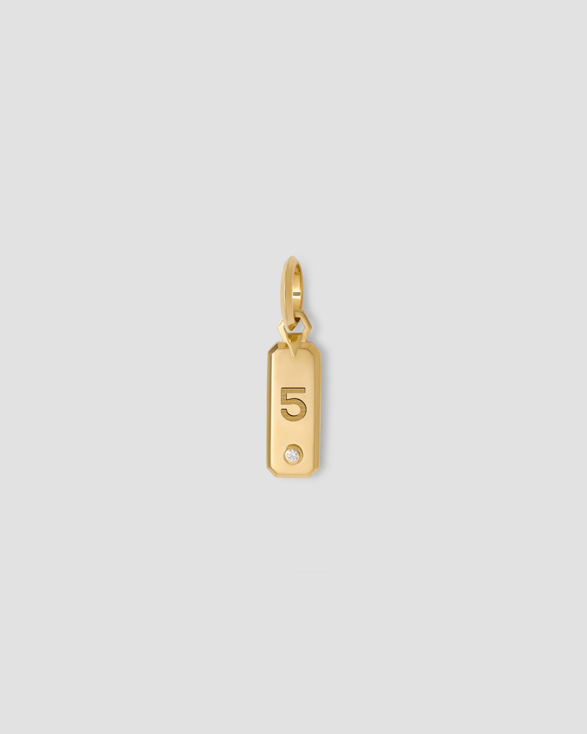 Minimal Block Number Dog Tag in 18K Yellow gold charm - product detail shot | custom charm necklace