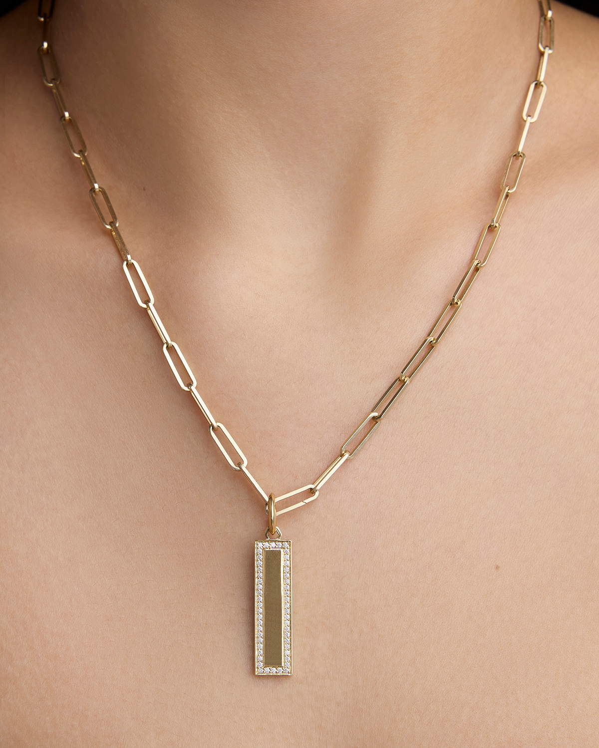 Luxe Narrow Classic Dog Tag in 18K Yellow Gold charm - close-up detail | gold charm necklace