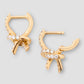 Knot Micro Huggie in 18K Yellow Gold with Pavé White Diamonds