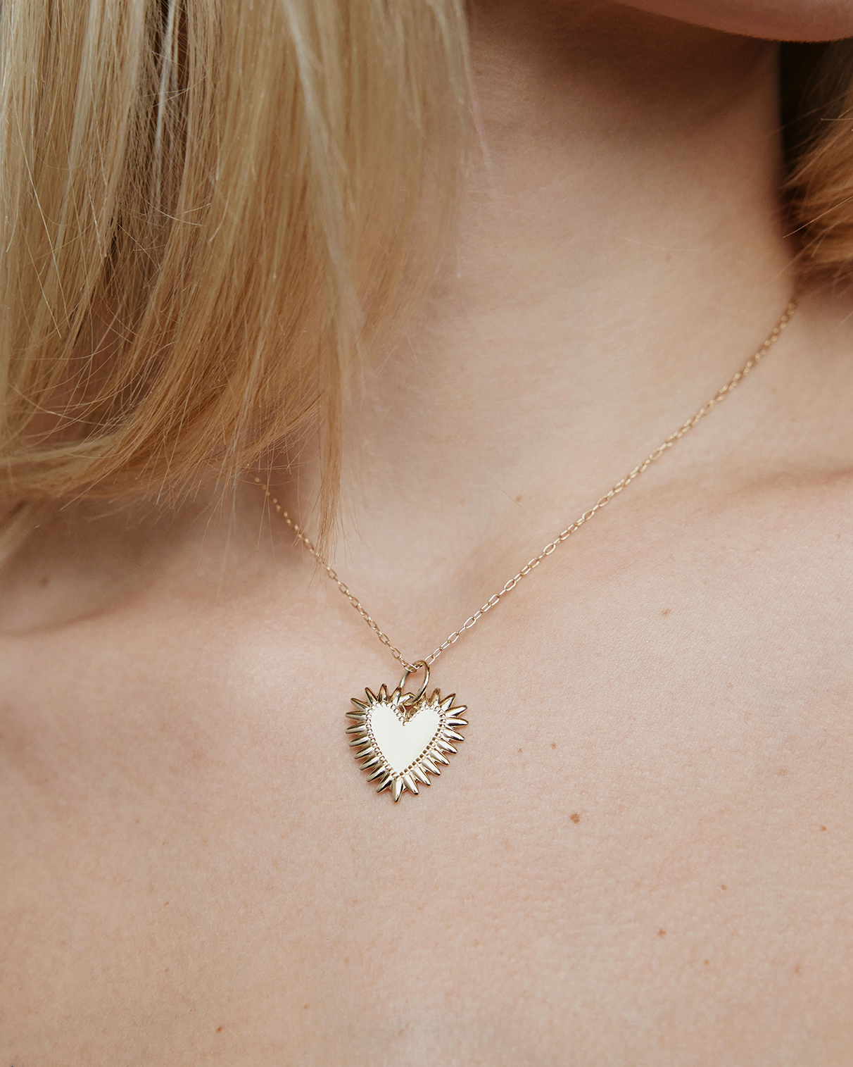 Image of model wearing the plain Fierce Heart charm on a chain