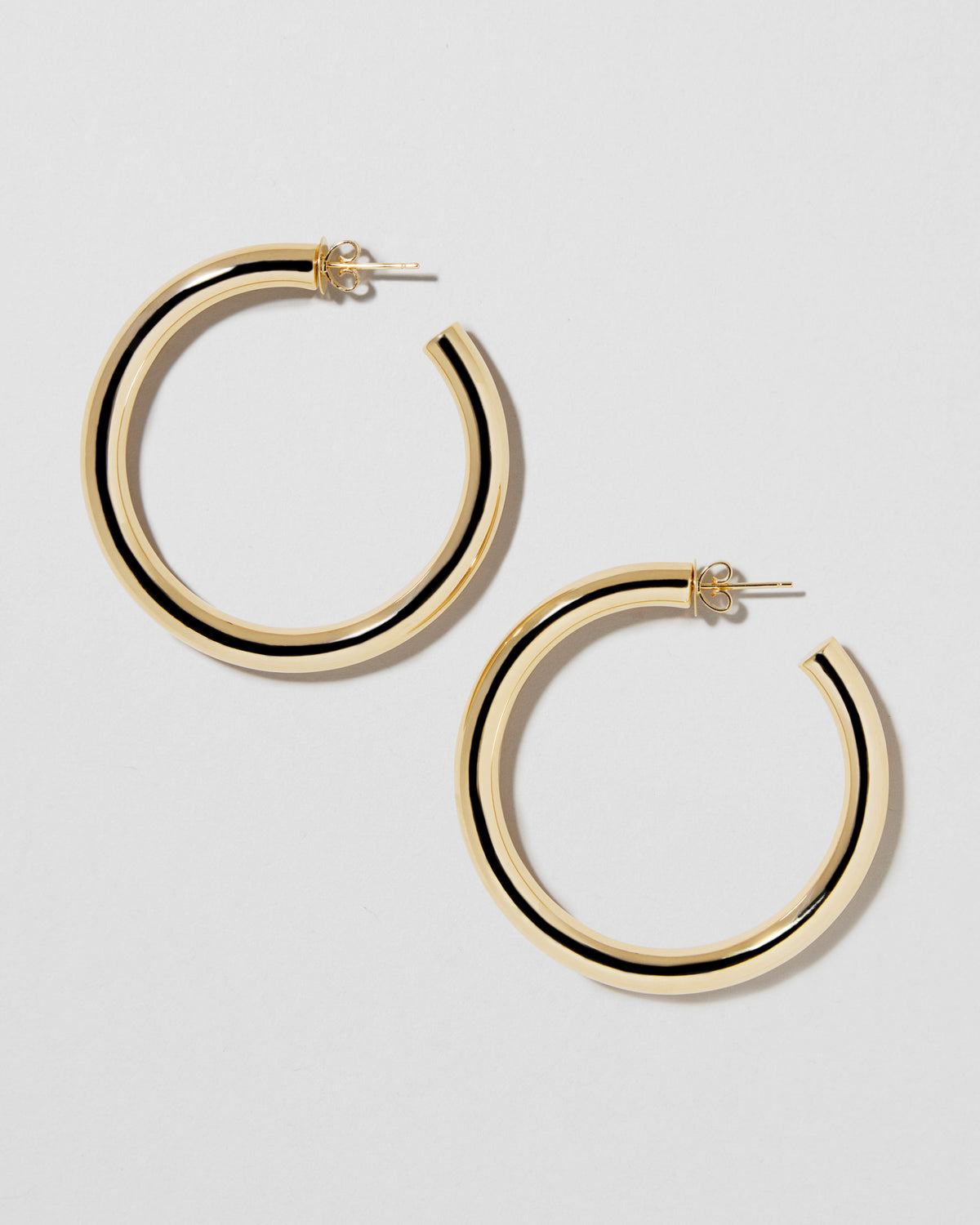 1.5" Natasha Hoops in 14K Yellow Gold earring - close-up detail | gold hoop earrings