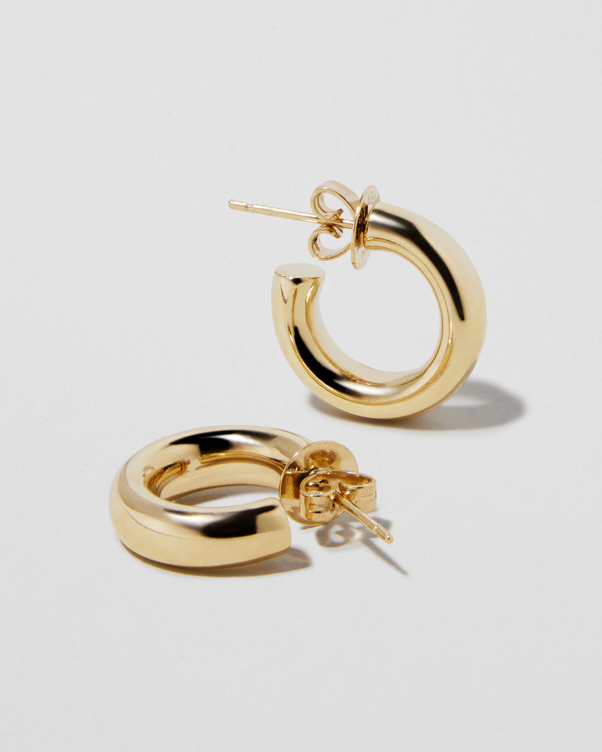 Lilly Huggies in 14K Yellow Gold 18K gold earring - close-up detail | hoop earrings