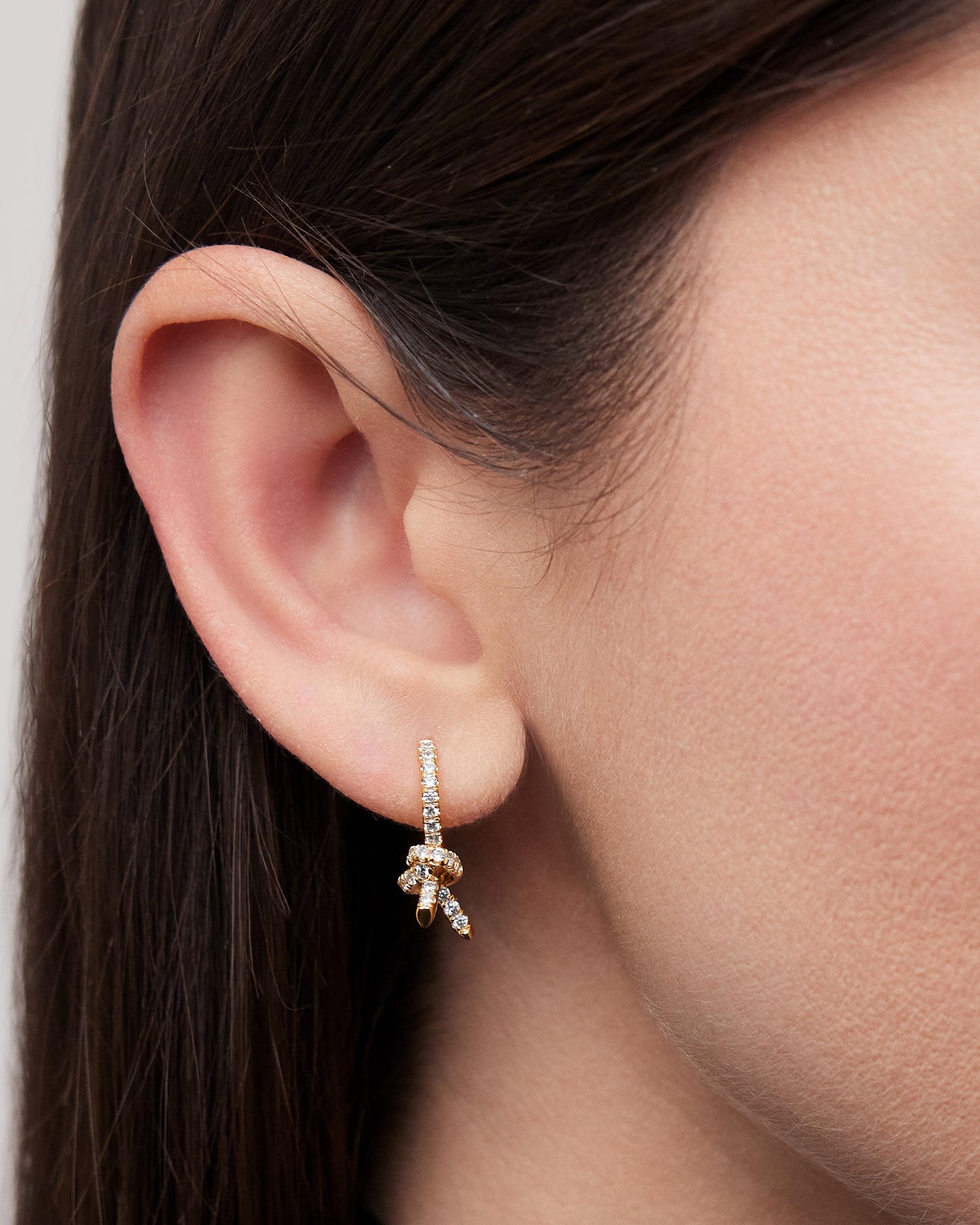 Knot Huggie in 18K Gold with Pavé White Diamonds