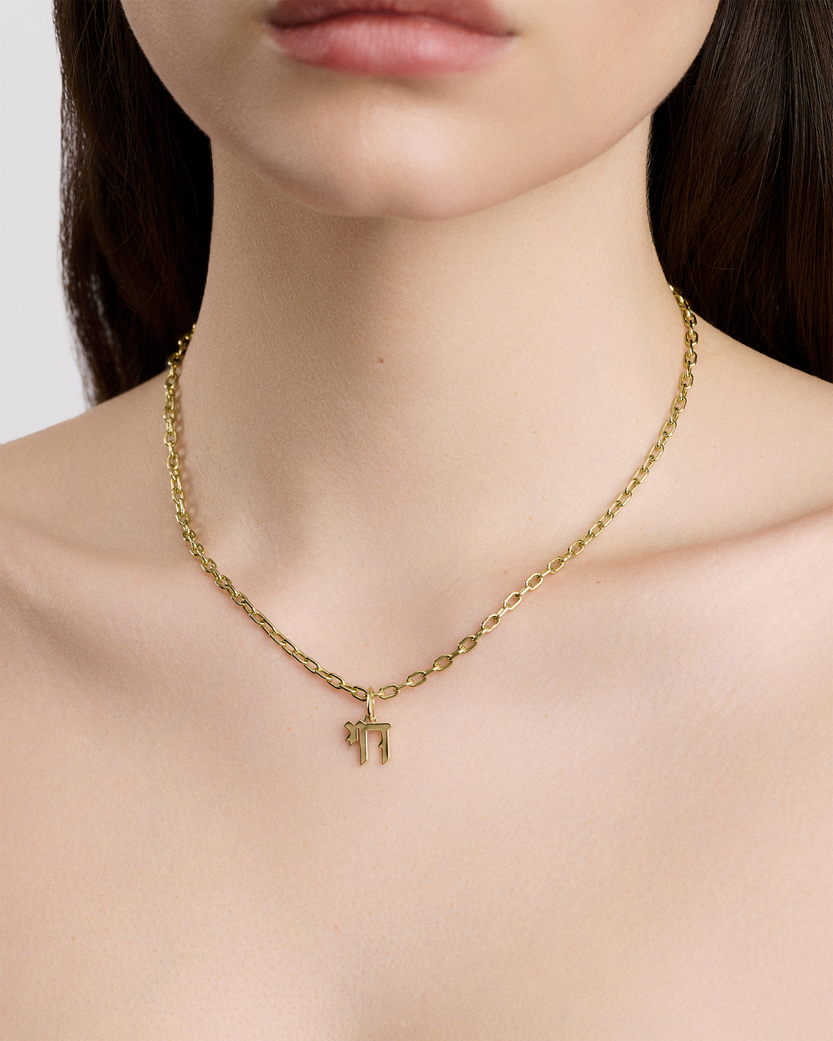 Chai Charm gold charm - close-up detail | charm necklaces