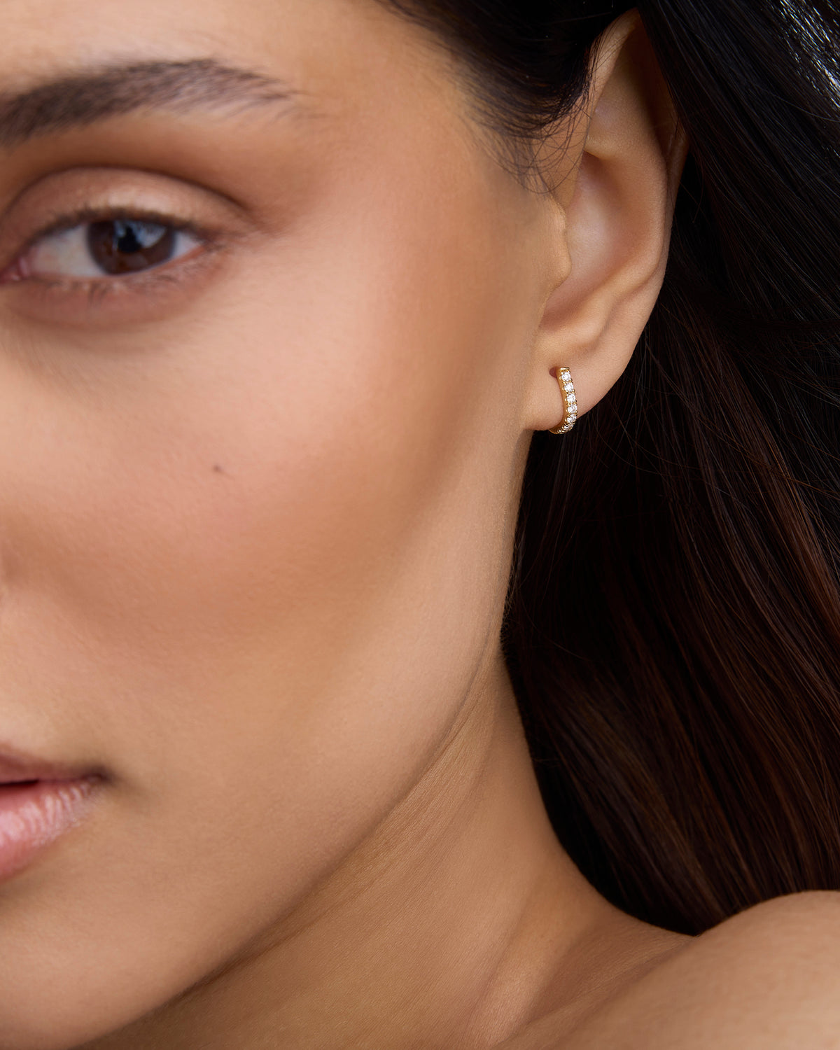 Micro Pavé Diamond Level Huggie in 18K Yellow Gold earring - close-up detail | diamond huggie earrings