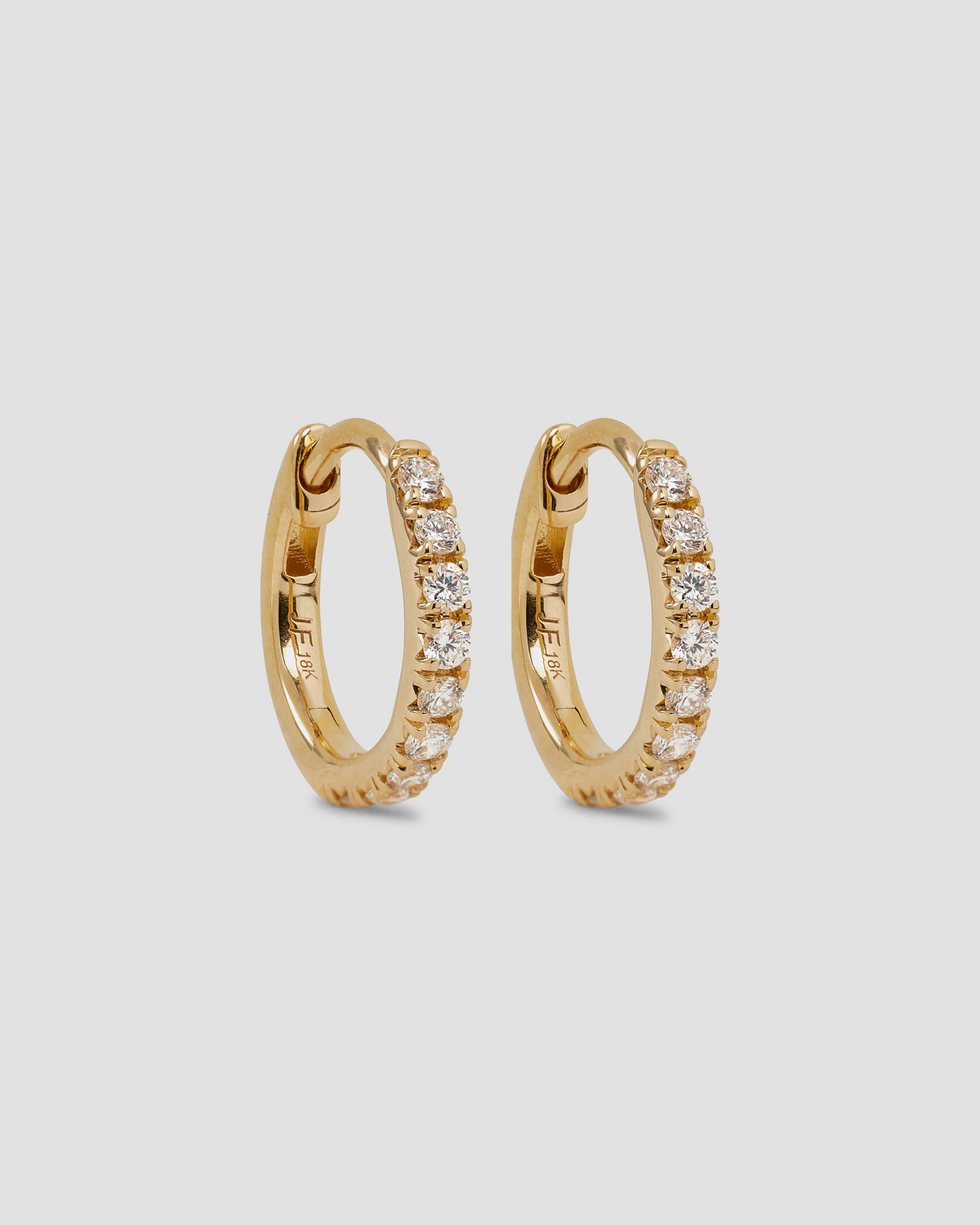 18K Essential Pavé Tiny Huggie gold earring - styled on model | diamond huggie earrings