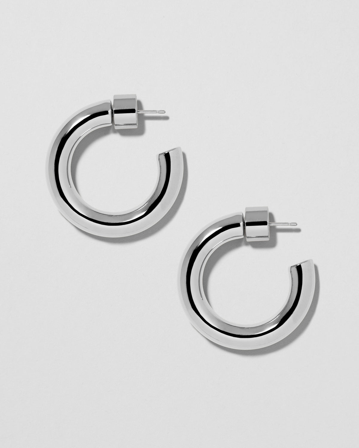 Natasha Huggies earring - product detail shot | gold huggie earrings