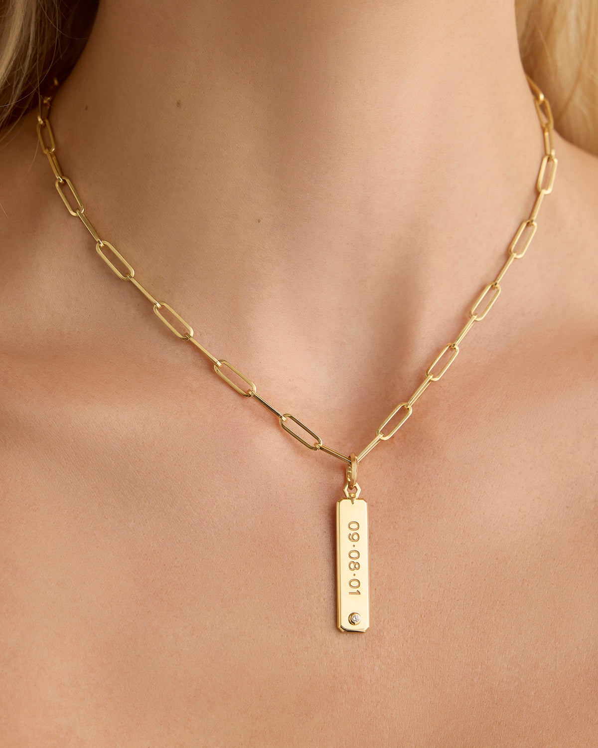 Personalized Beveled Dog Tag in 18K Yellow gold charm - close-up detail | charm necklaces