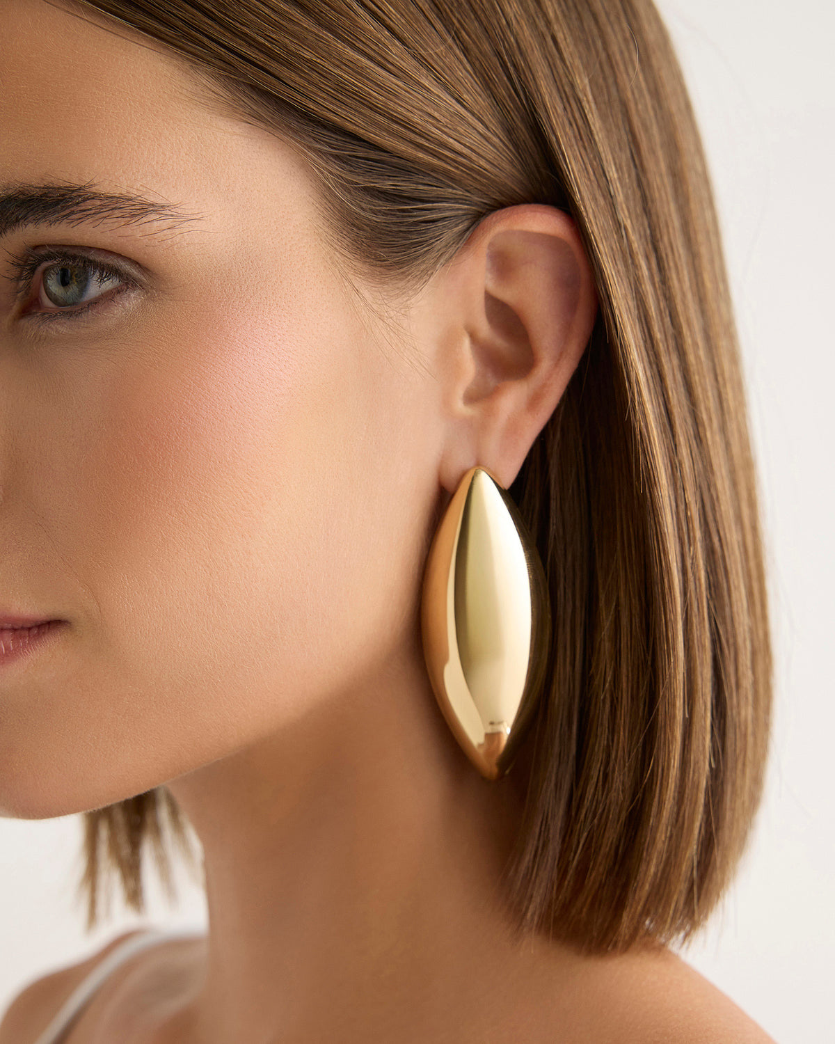 Puffy Dagger Earrings - front view | gold earrings