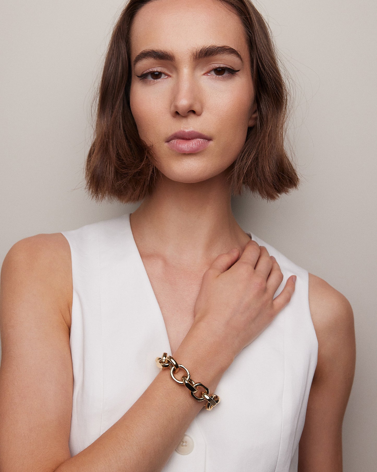 Model posing wearing bracelet. 