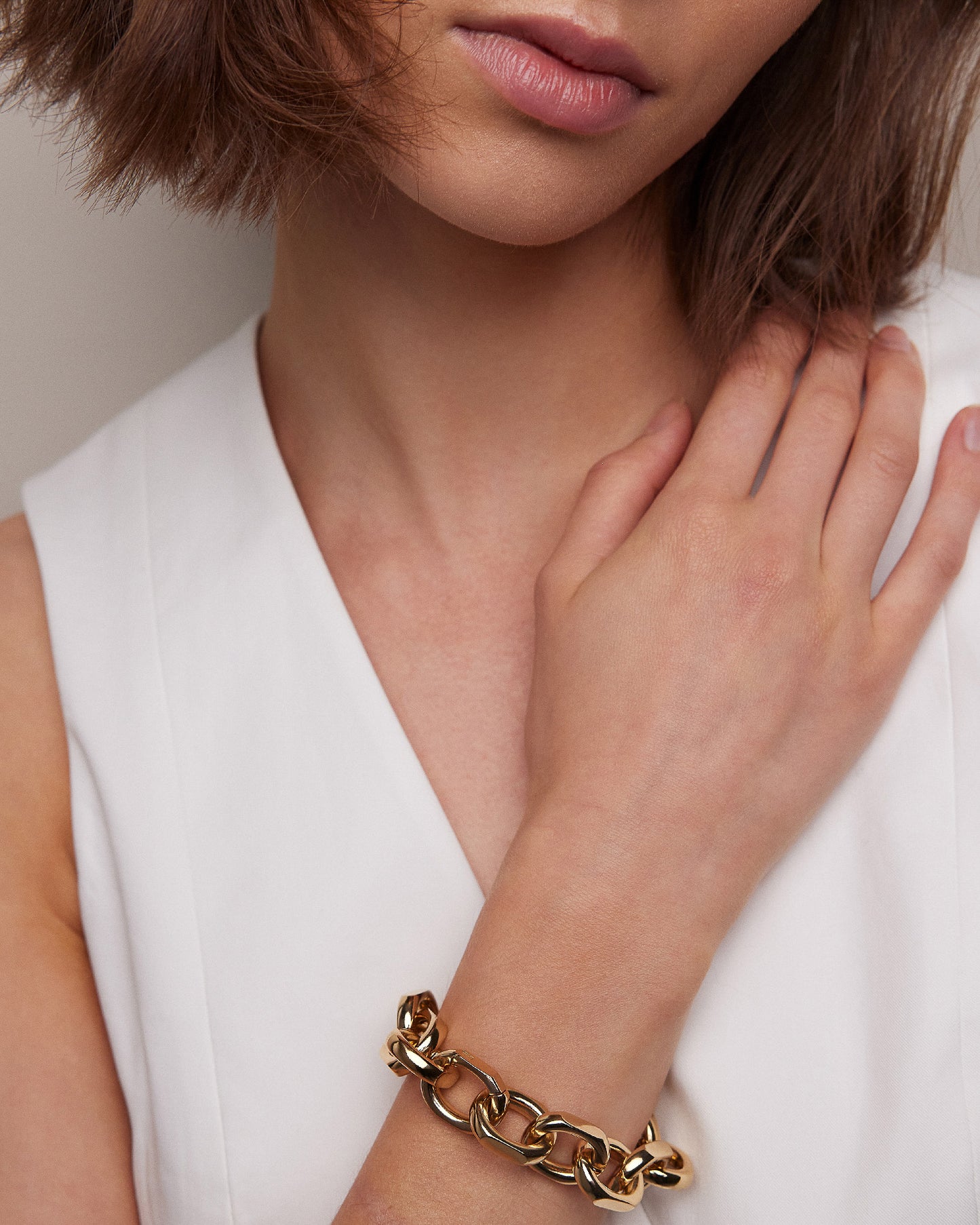 Model posing wearing bracelet. 