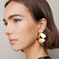 Model wearing Puffy Cushion Earrings. 