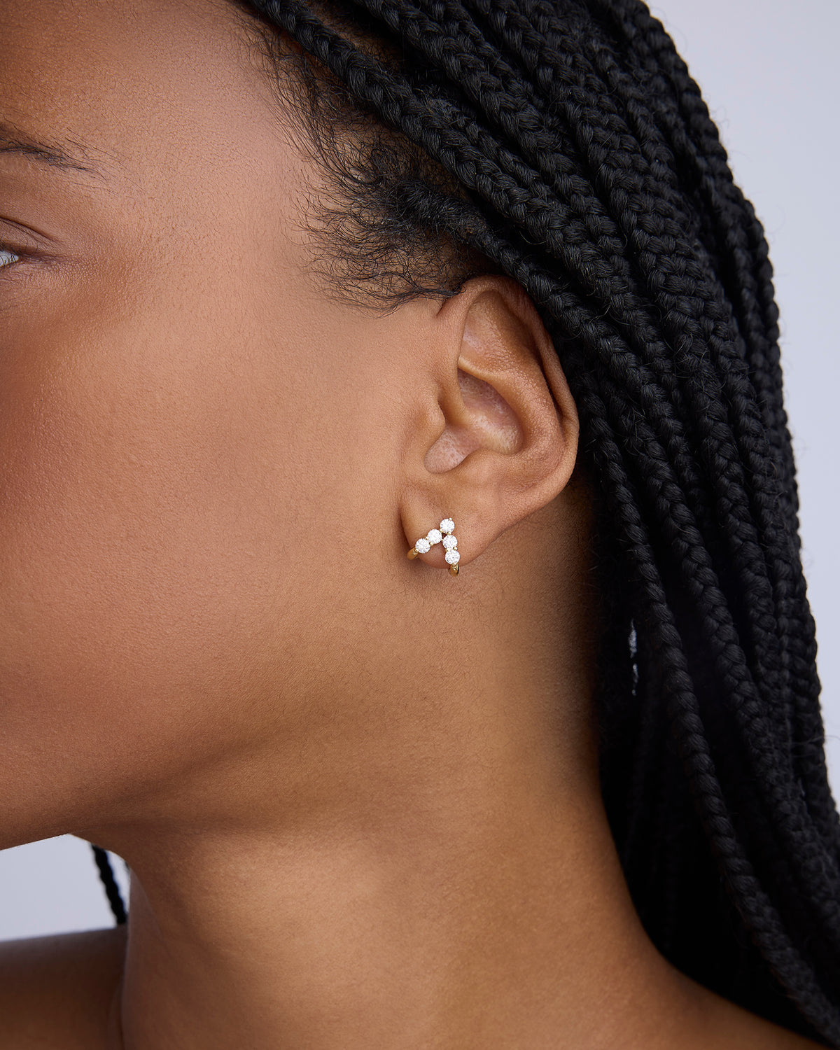 Floating Five Diamond Double Huggies 18K gold earring - close-up detail | diamond huggie earrings