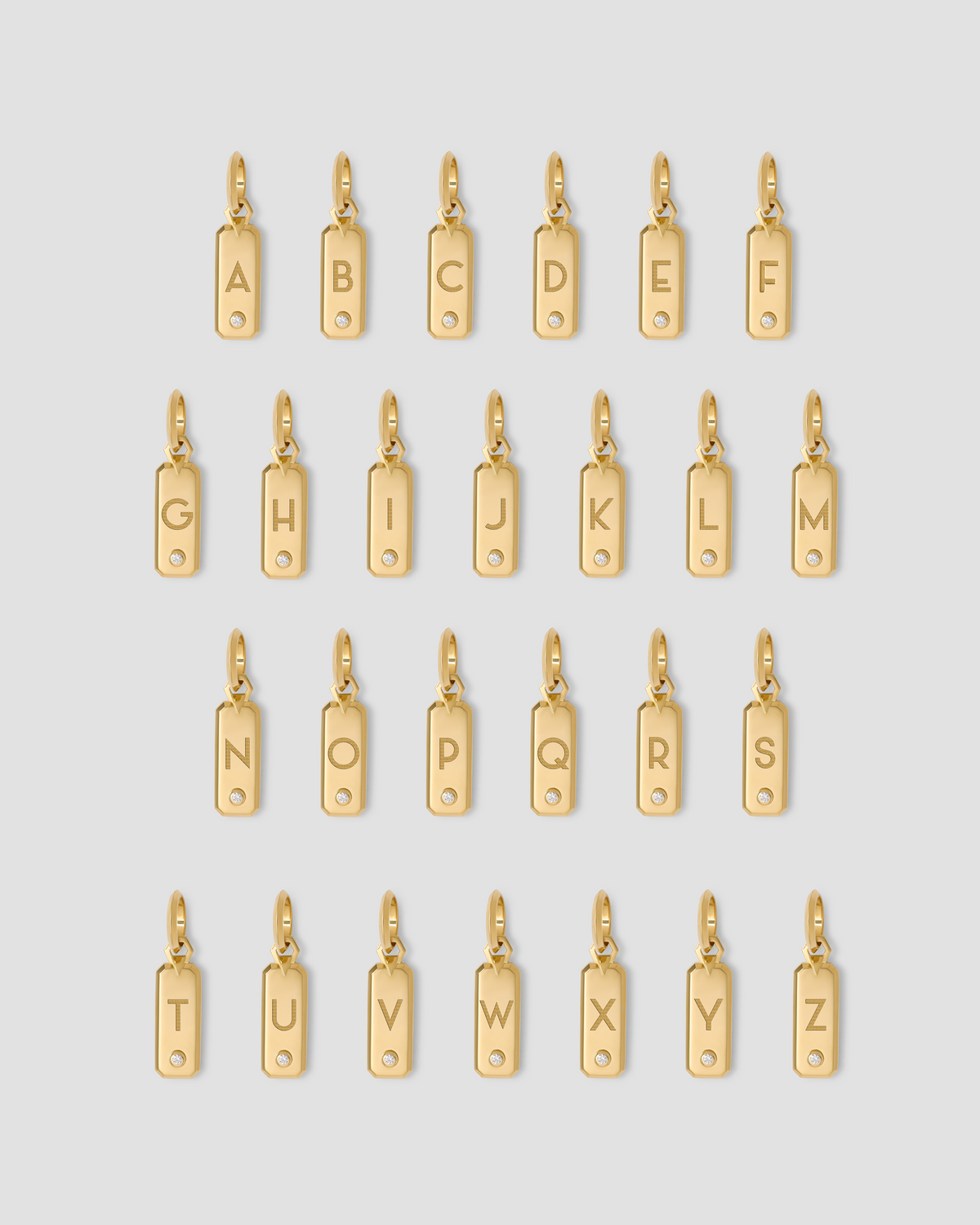 Minimal Block Letter Dog Tag in 18K Yellow gold charm - close-up detail | necklace with charms