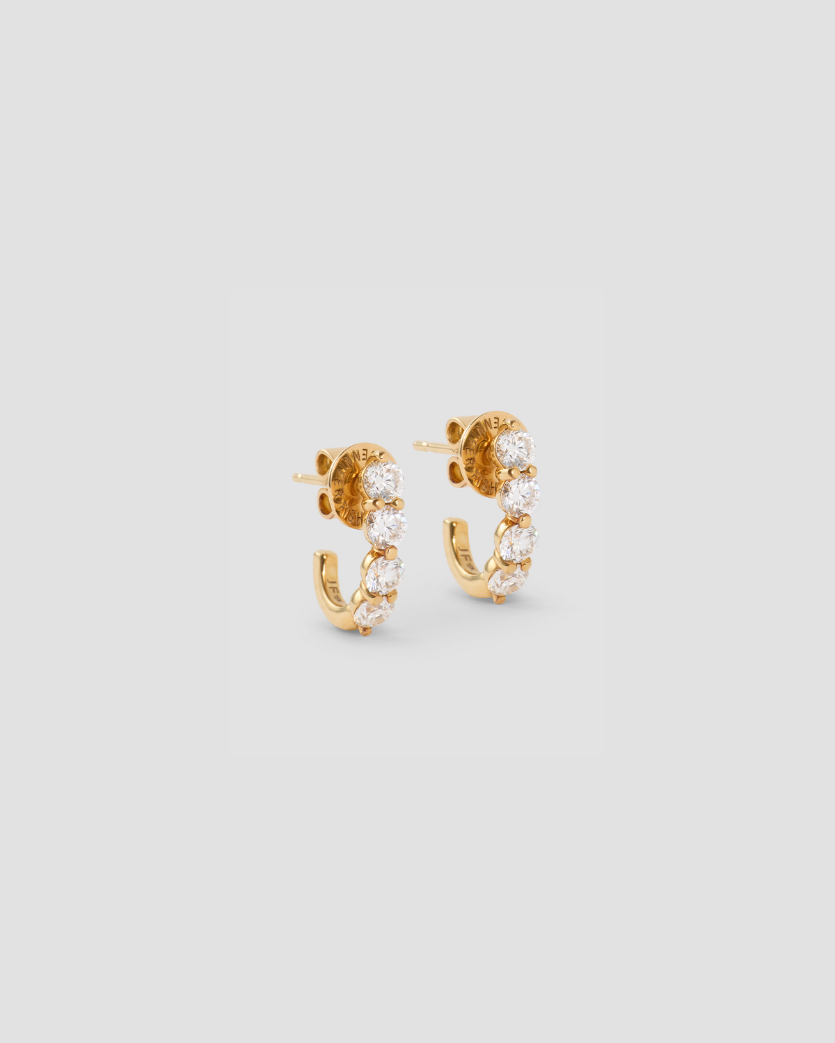 Floating Four Diamond Huggies gold earring - front view | diamond huggie earrings