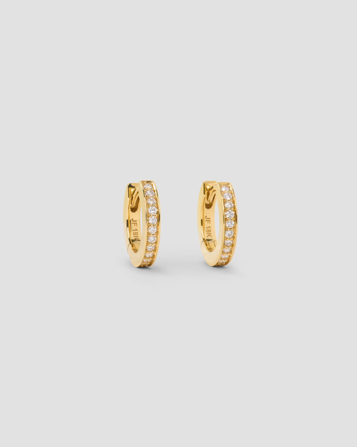 18k Extra Small Huggie with Pavé Diamonds 18K gold earring - front view | diamond huggie earrings