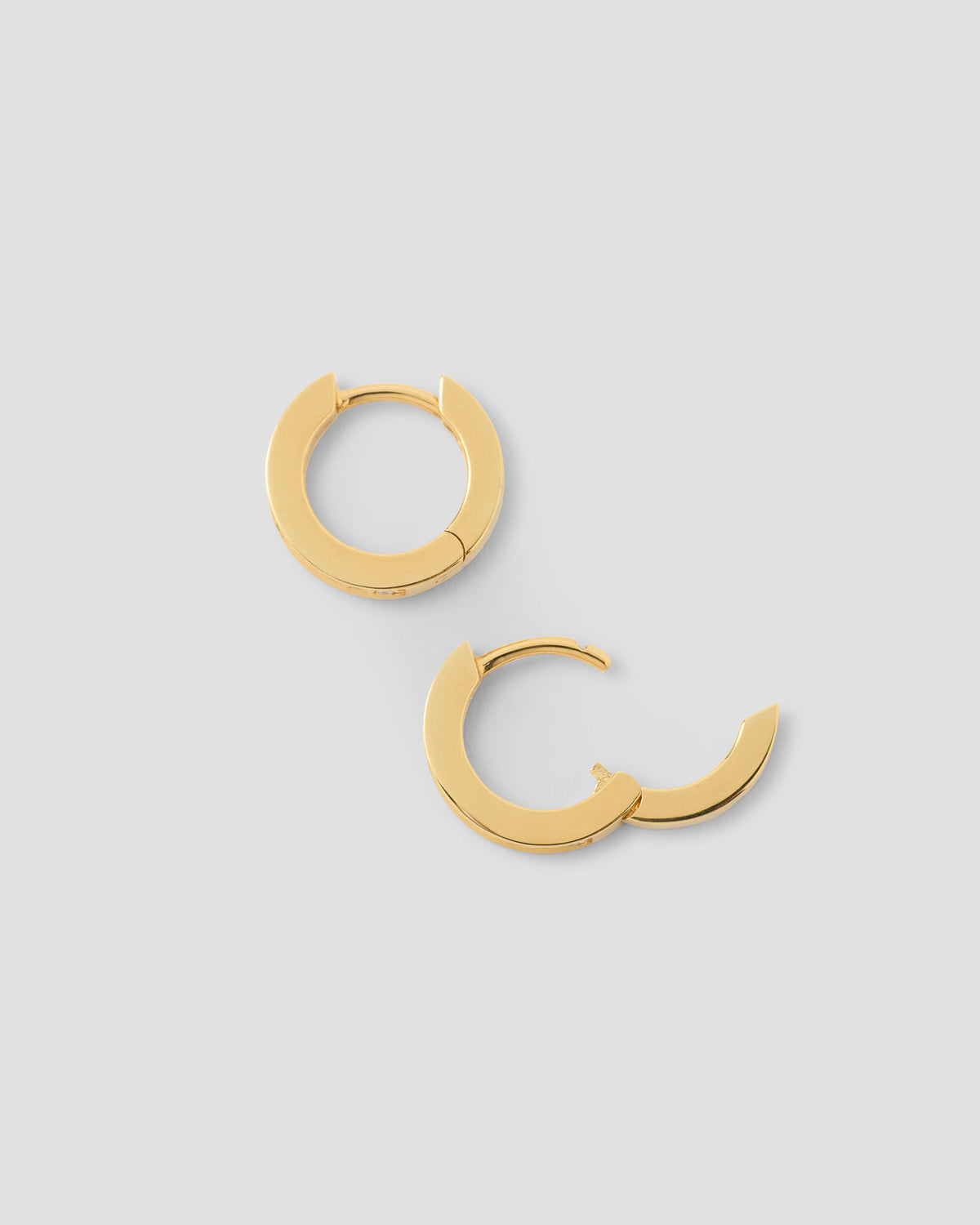 18k Extra Small Huggie with Pavé Diamonds 18K gold earring - close-up detail | diamond huggie earrings