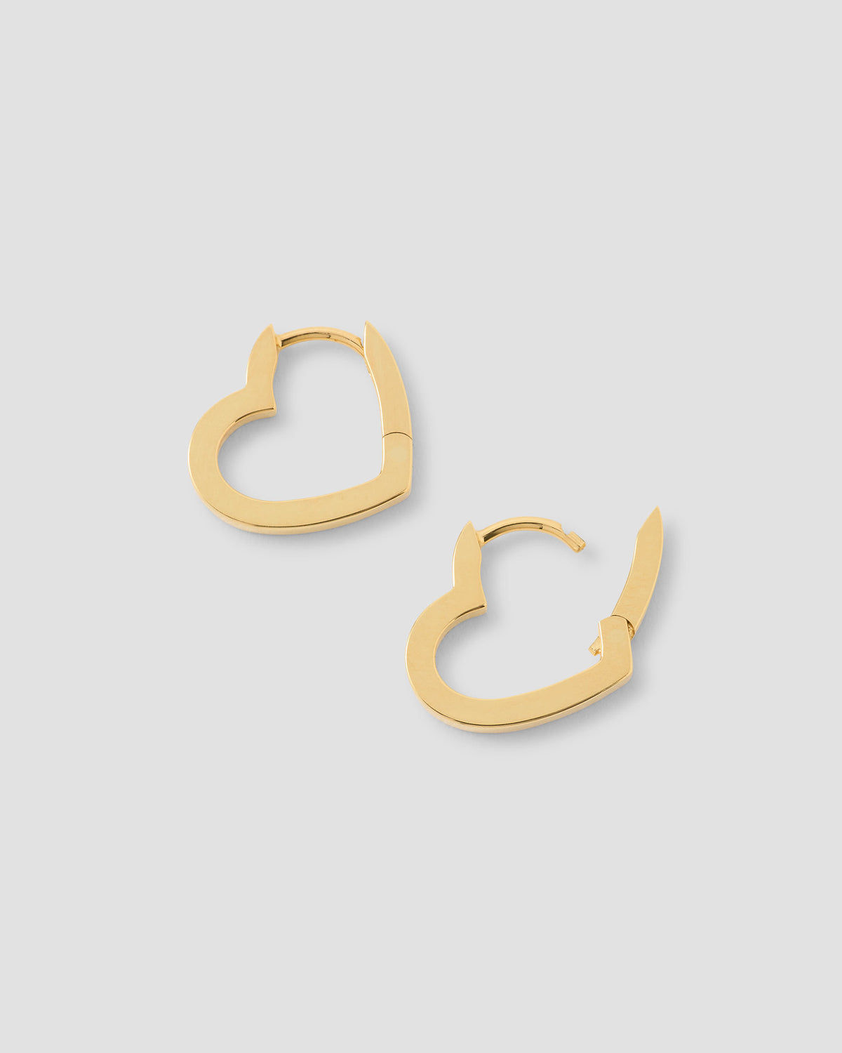 18k Small Heart Huggie earring - close-up detail | gold huggie earrings
